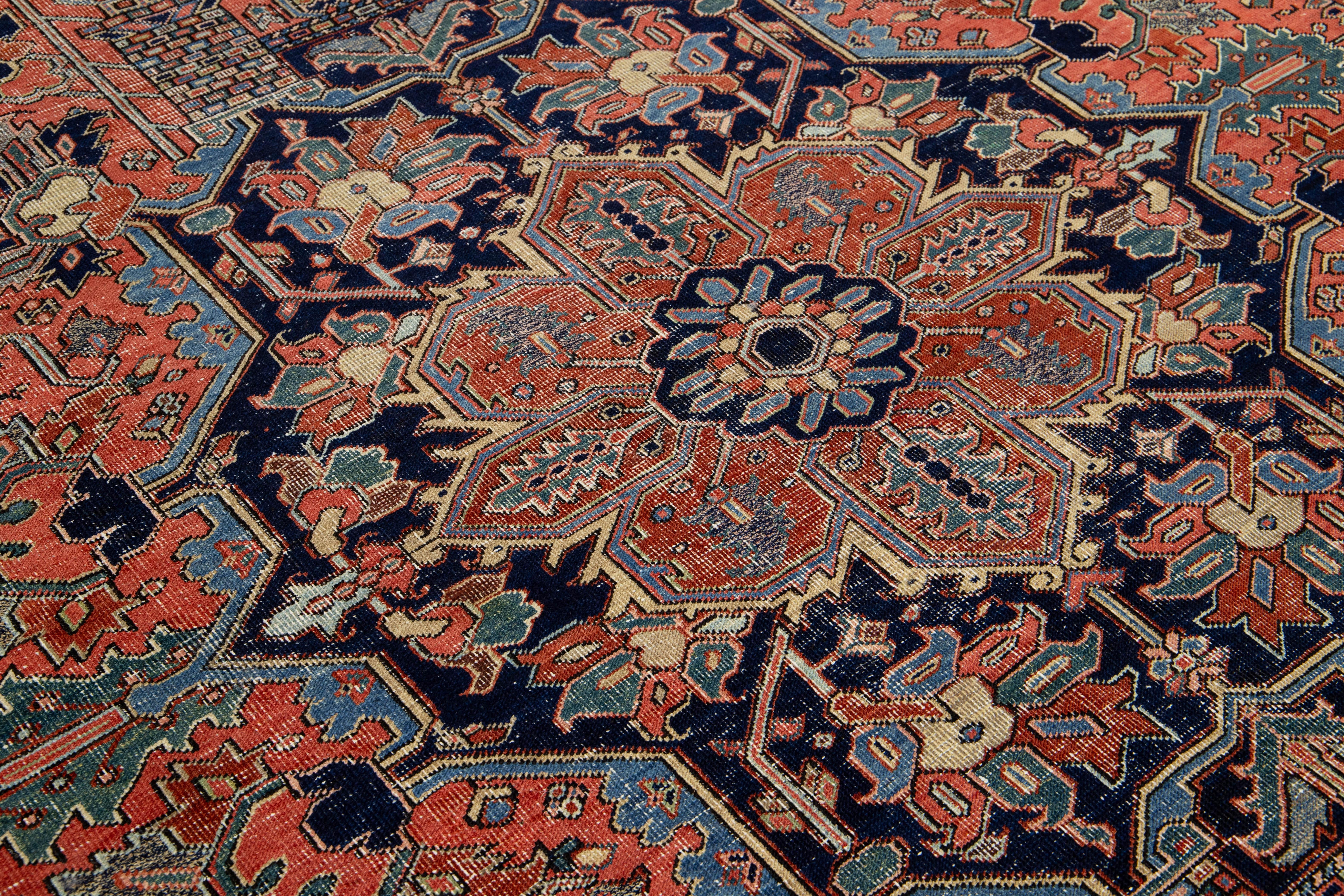 20th Century Room-Sized Antique Persian Heriz Rug in Red Wool Featuring a Medalllion Motif For Sale
