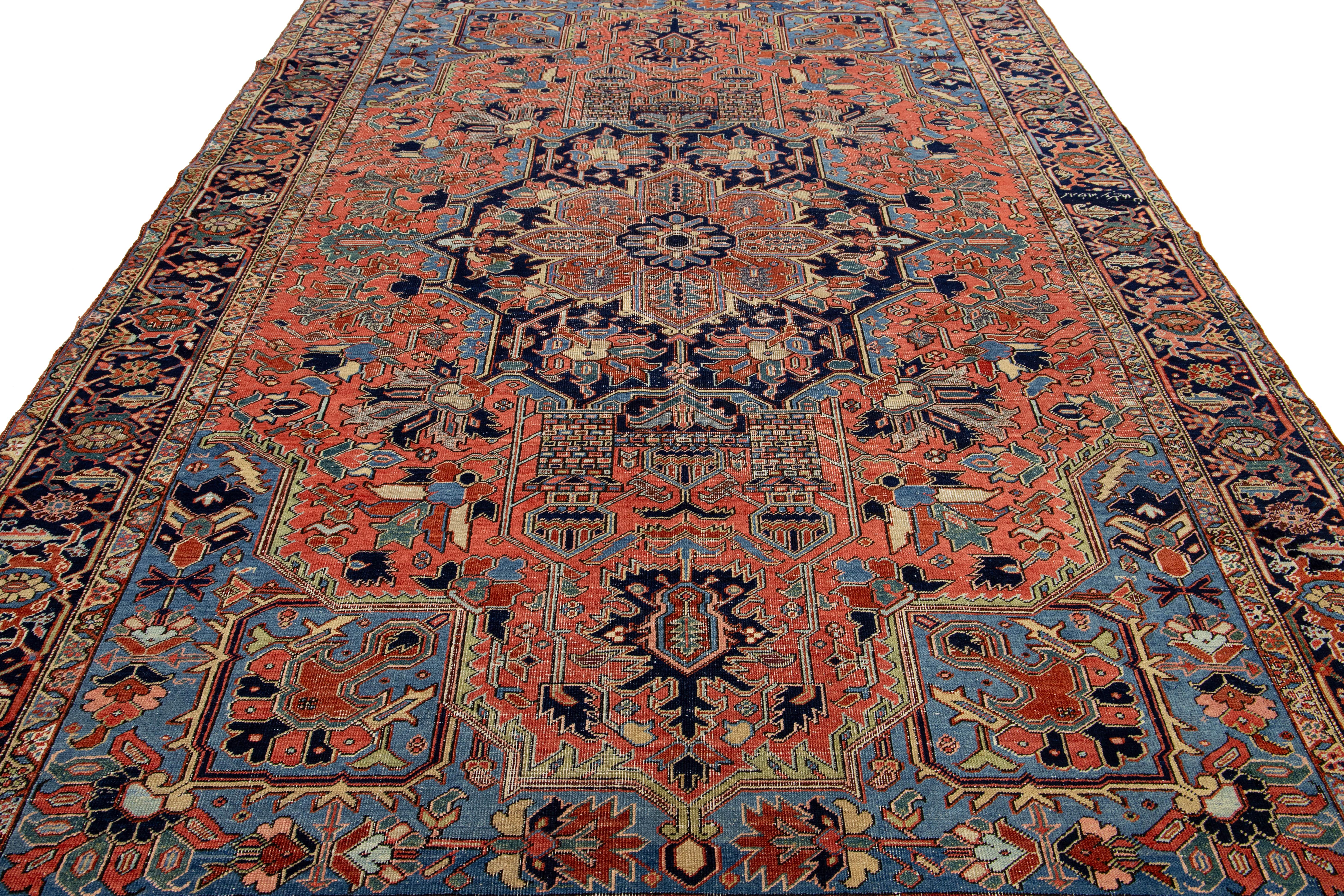 Room-Sized Antique Persian Heriz Rug in Red Wool Featuring a Medalllion Motif For Sale 1