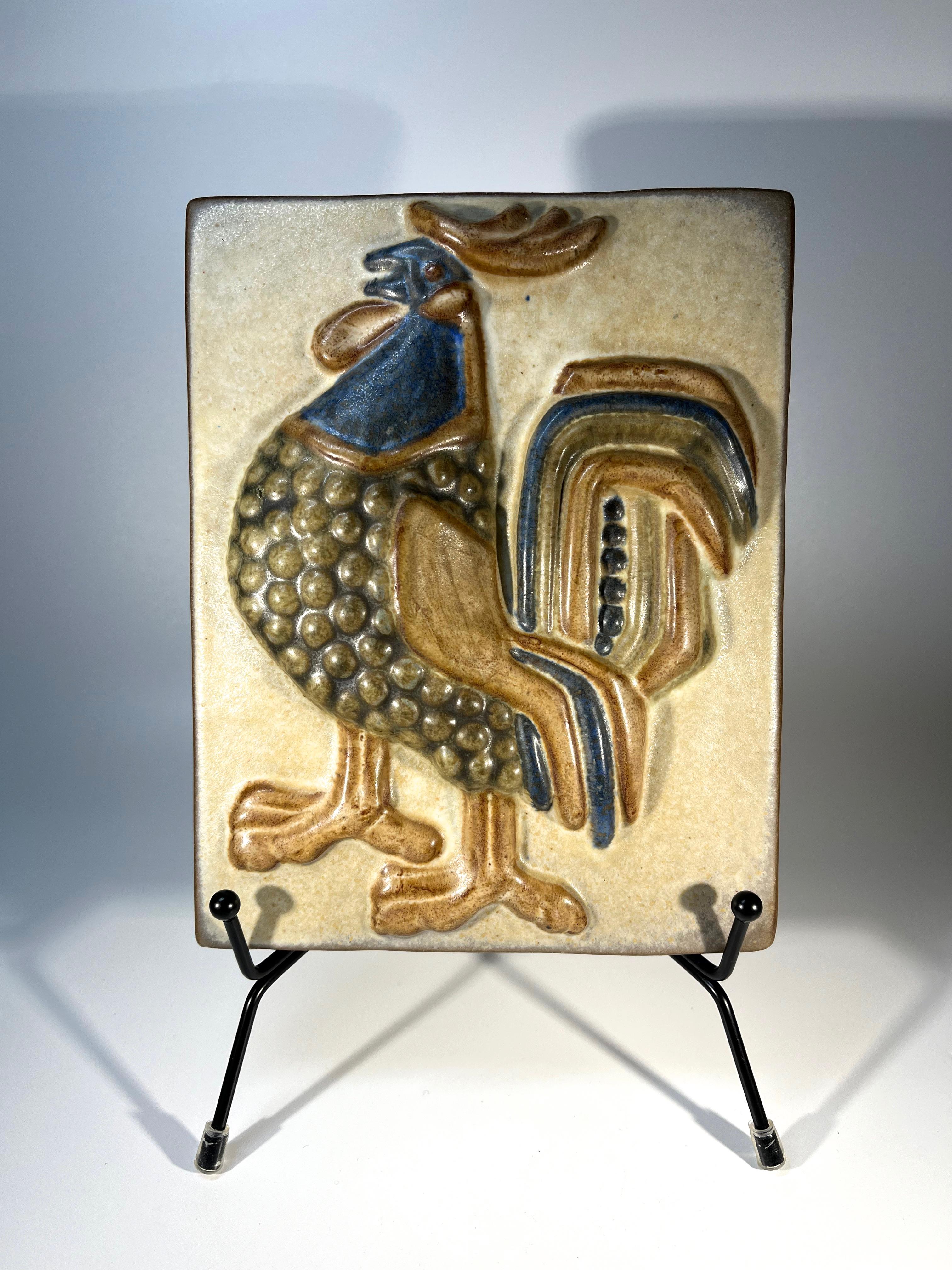 Bold rooster wall plaque by Marianne Starck for Michael Andersen, Denmark 
Wonderfully hand crafted by the renowned Danish ceramicist
Stamped MS, Three Herrings mark, and #6071 on reverse
Width 5.5inch, Height 7 inch, Depth 1 inch
Weight 1lb 7oz
In