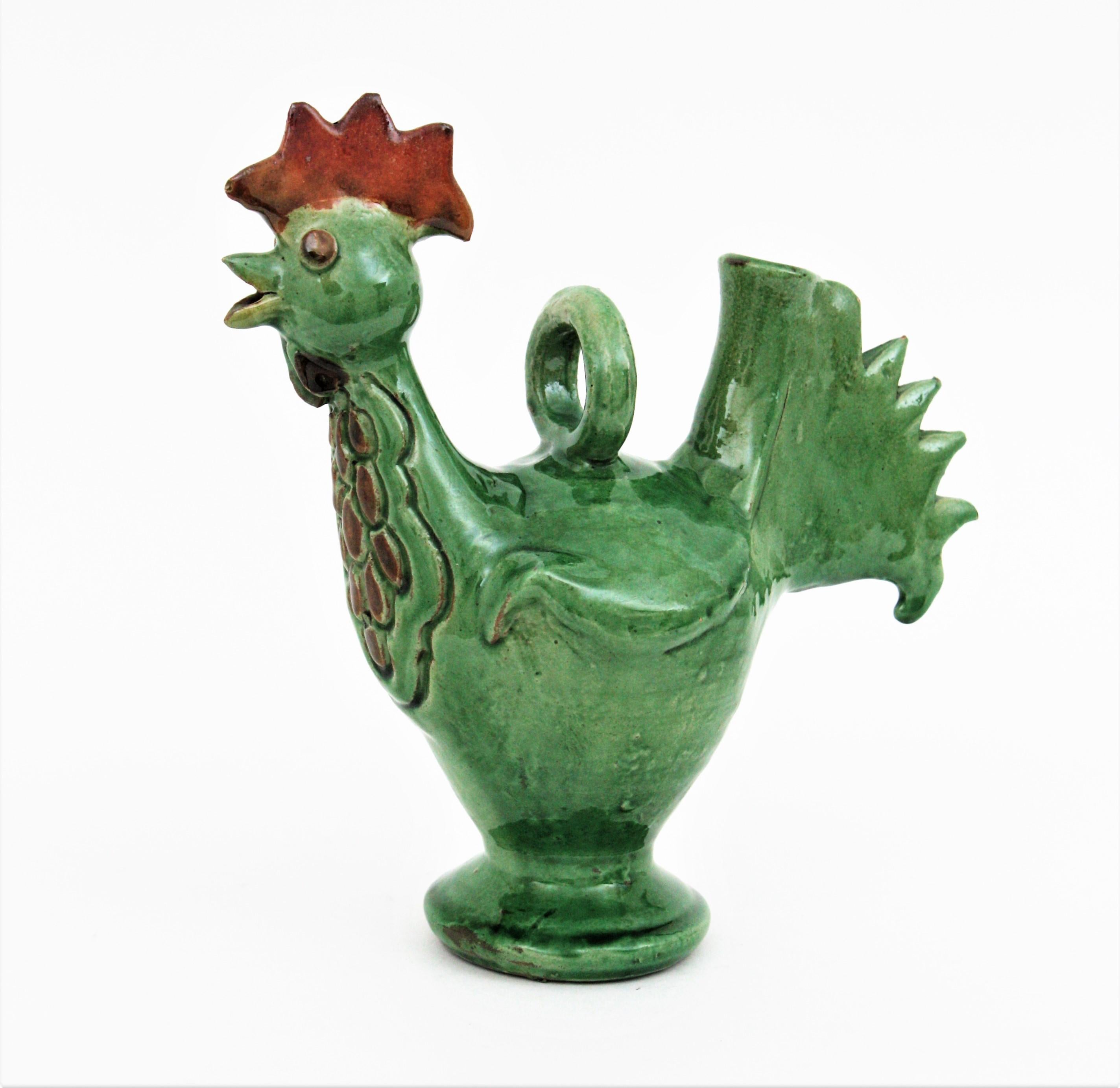 Eye-catching green and brown Majolica ceramic rooster jug / pitcher, Spain, 1950s.
Andalusian ceramic decorative rooster shaped jug in shades of green with brown accents.
A cool accent to any kitchen or to be user as serving pitcher. Lovely as a