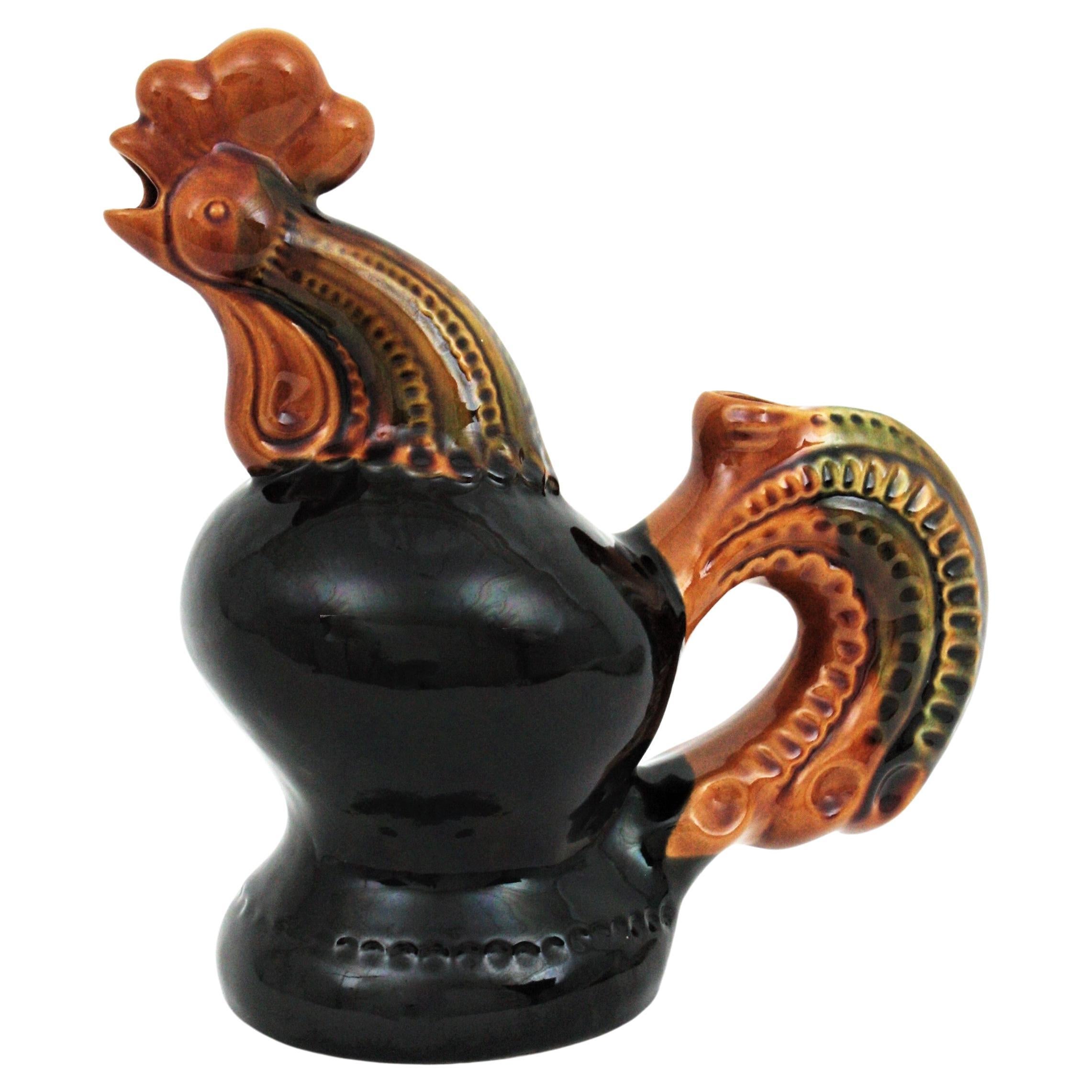 Eye-catching black and amber Majolica ceramic rooster jug / pitcher, Ukraine, 1950s.
A cool accent to any kitchen or to be user as serving pitcher. Lovely as a part of a ceramics collection displayed in a cabinet.
Mark from the manufacturer