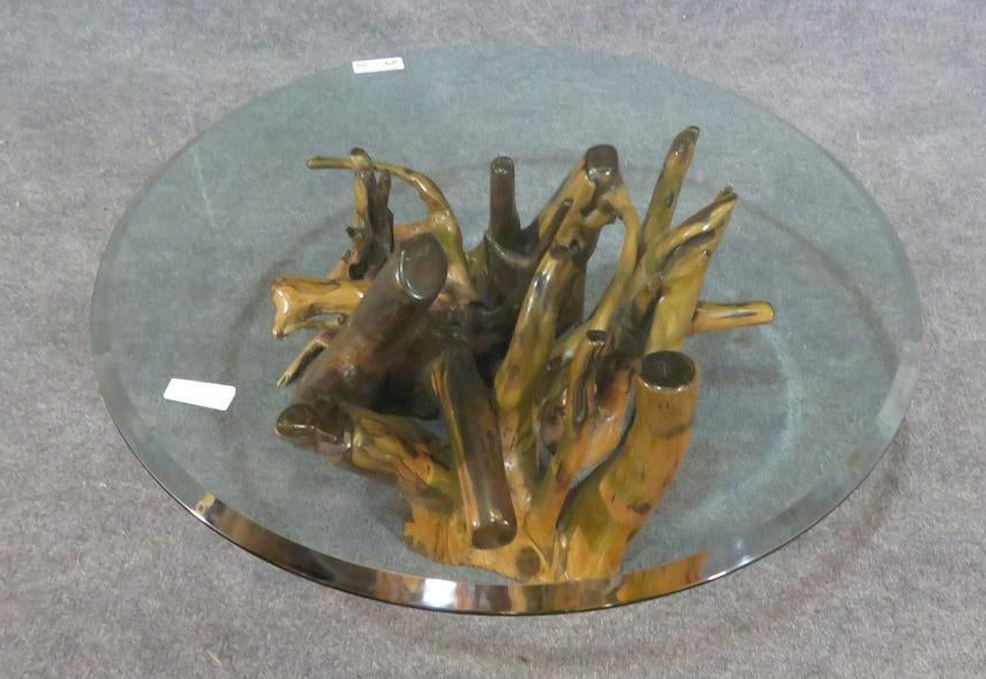 Beautiful root base coffee table with round glass top.
(Please confirm item location - NY or NJ - with dealer).
       
