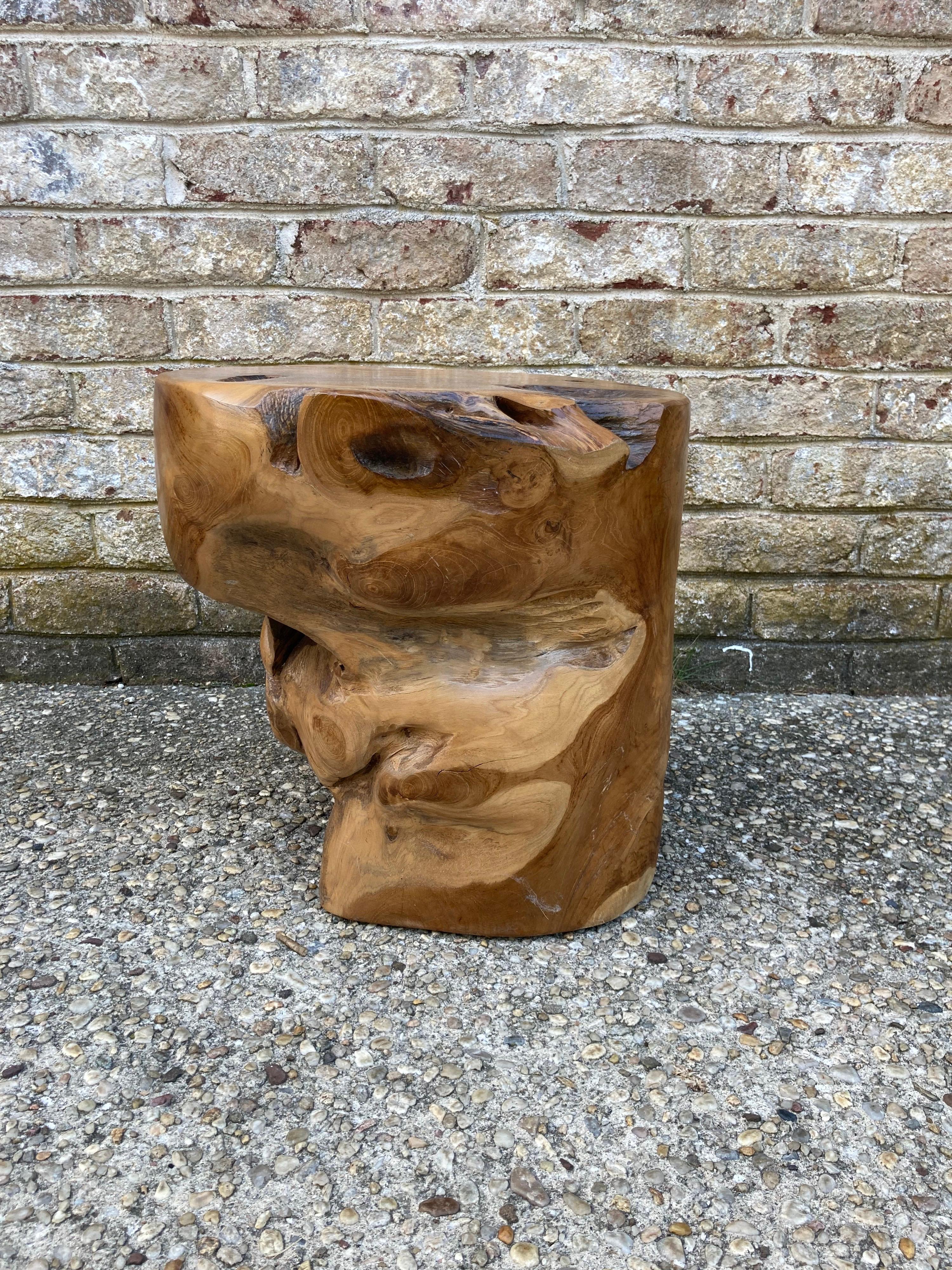 Natural free form wood stump table or stool.