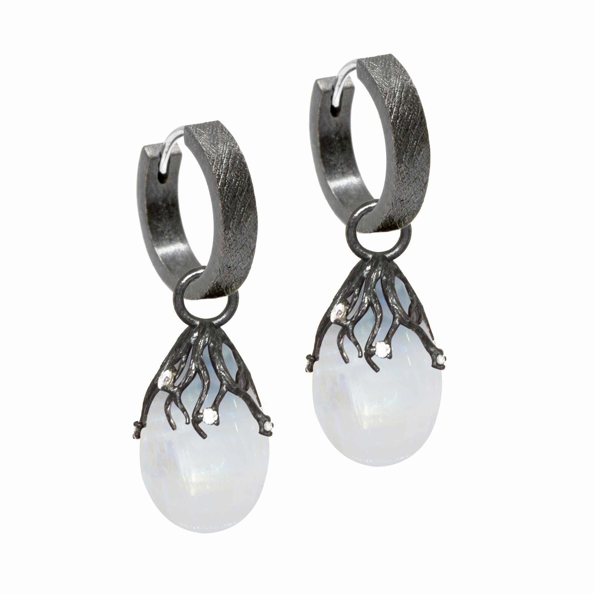 With rich, regal Moonstone, our Rooted Silver Earring Charms make the perfect addition to any hoops or charms.
Nina Nguyen Design's patent-pending earrings have an element on the back of the stud or charm to allow these pieces to transformed into