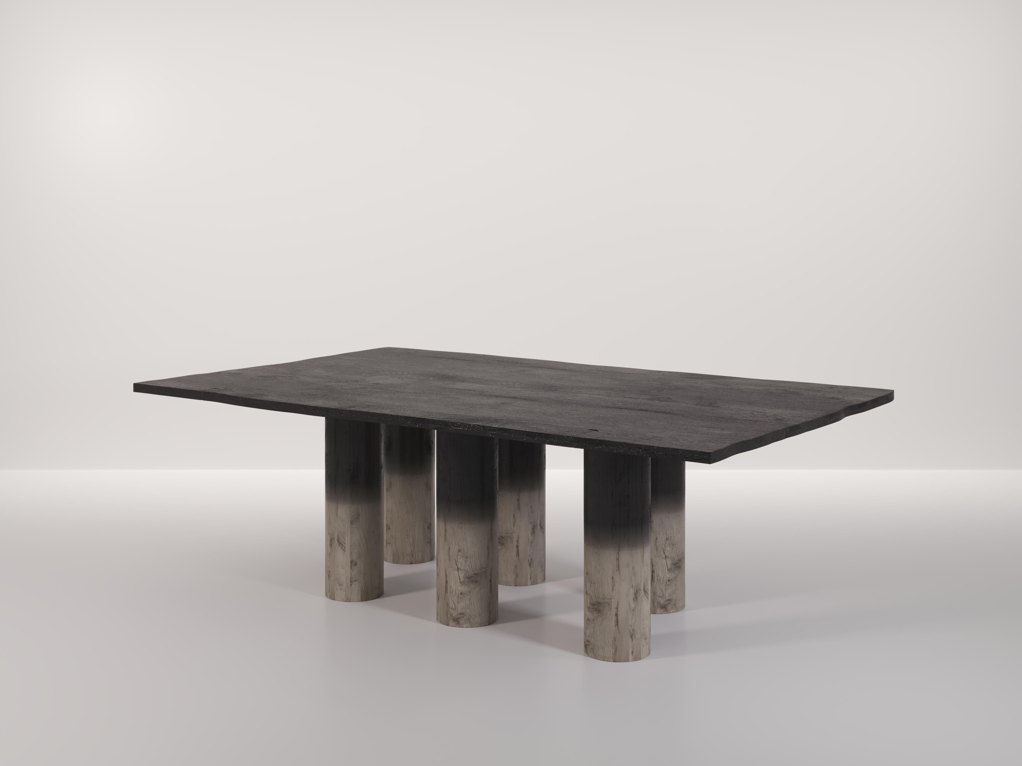 The Roots Table was designed to showcase the effect of burning the wood. When treating the wood, Studio Effe gradually ended the burning process as they got closer to the bottom. Giving the piece a gradient of dark to pale wood. The top piece of