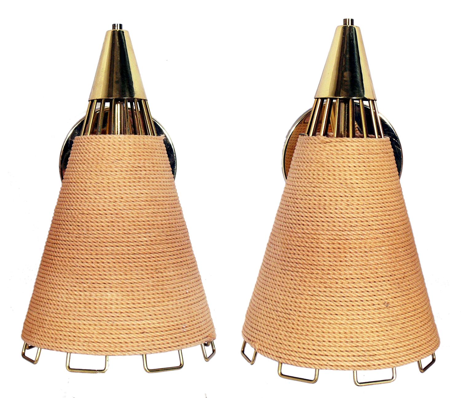 Rope and brass sconces, American, circa 1950s. 
The rope wrapped shades give them a great natural texture and nautical feel. Brass-plated metal retains warm natural patina. Rewired.