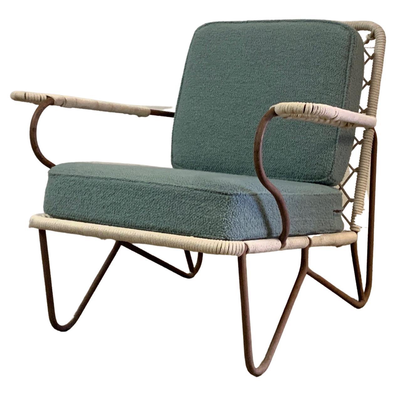 A rope and iron lounge chair.