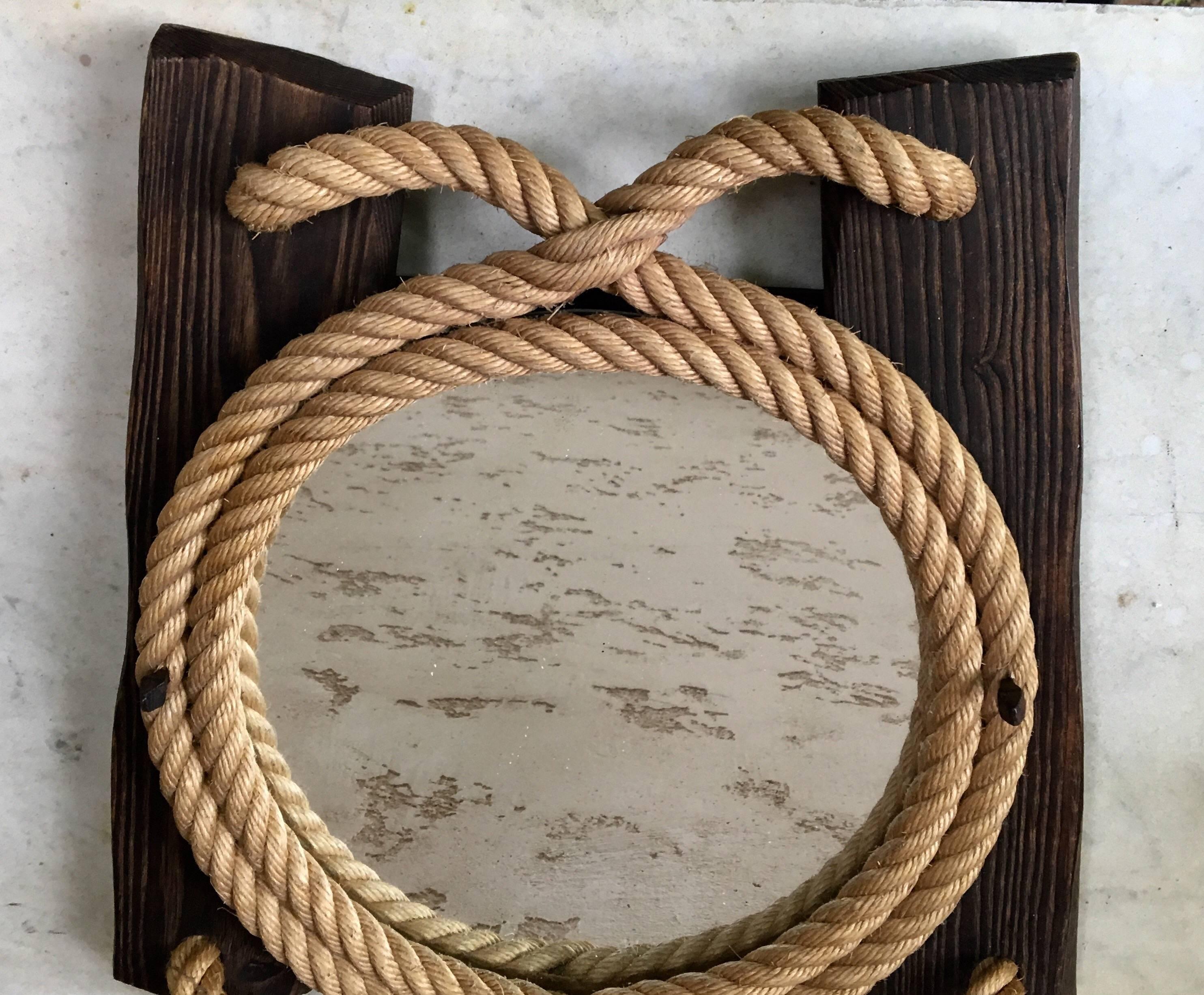 Interesting midcentury rope and wood mirror by Audoux Minet, circa 1960.
