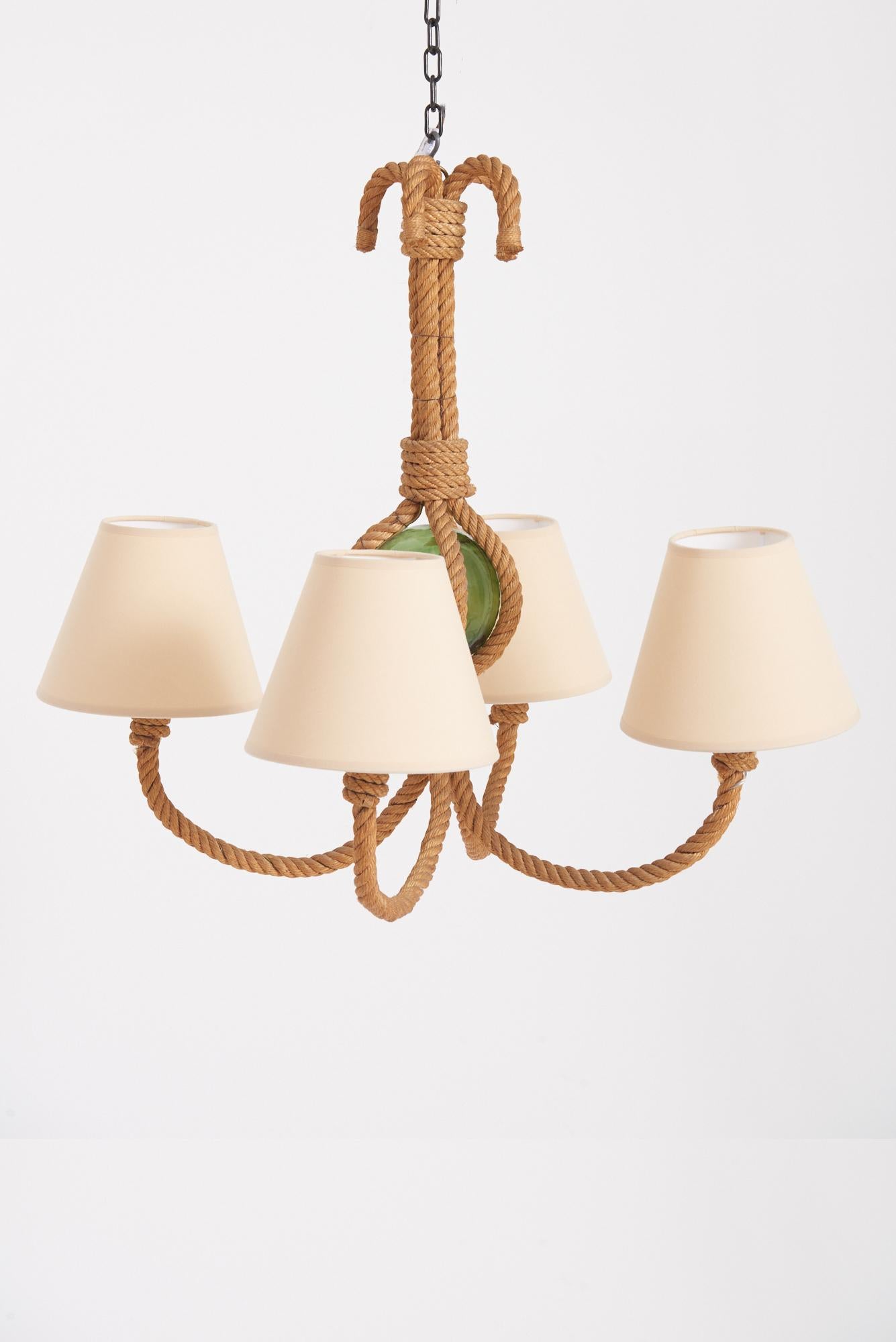 A four-arm rope and glass ceiling light by Audoux-Minet
France, 1950s
With the shades: 66 cm high by 75 cm diameter 
Lamp base only:  66 cm high by 60 cm diameter