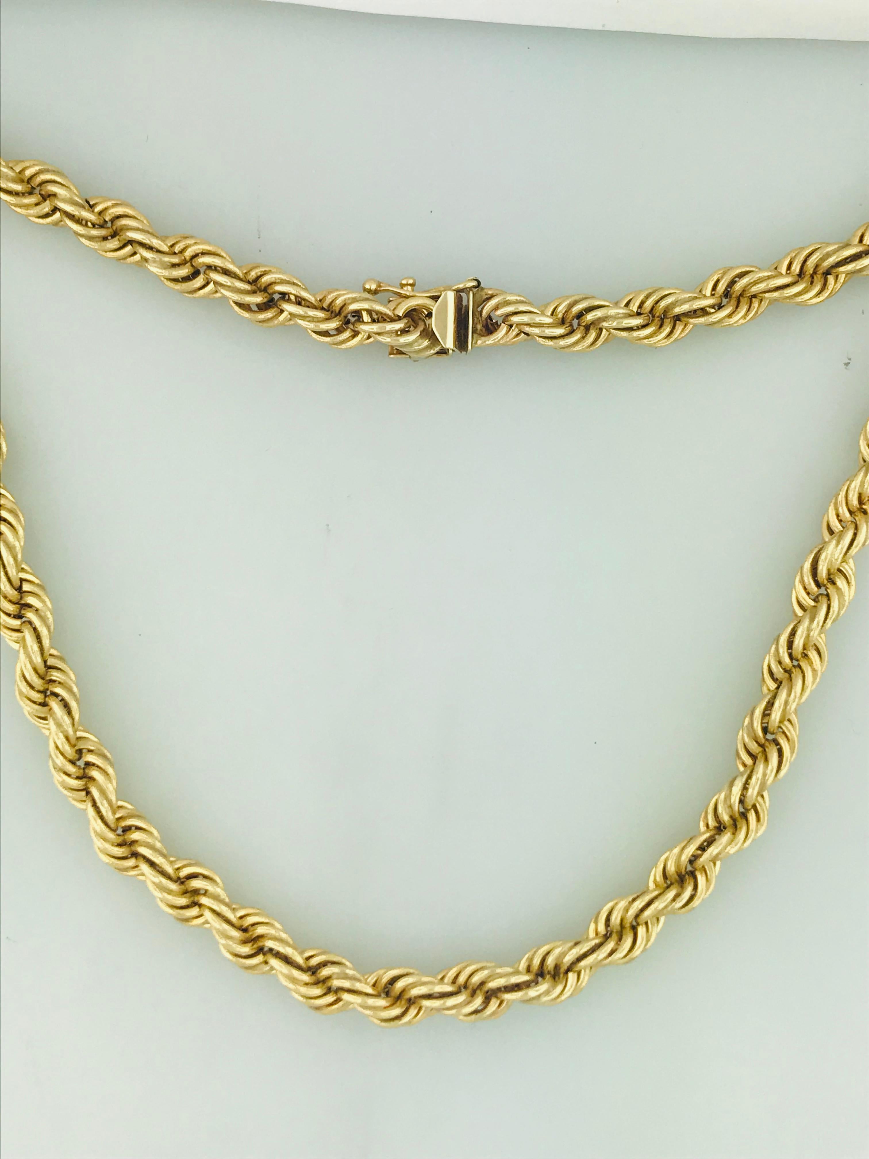 The 14 karat yellow gold rope chain is a 28 inch necklace with a 7mm wide rope chain design. The 14 karat yellow gold is bold and rich and looks great on every skin tone, paired with any attire. The chain would make a classic statement necklace, a