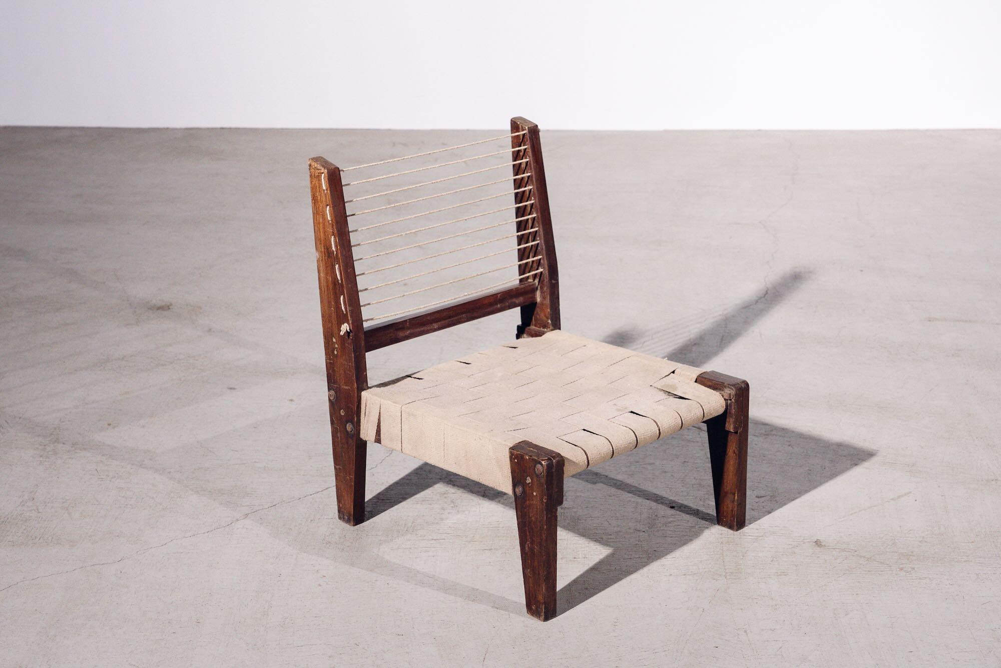 An authentic mid-century piece from Pierre Jeanneret’s legendary Chandigarh commission. Teak frame with hand-woven cotton seat & back.