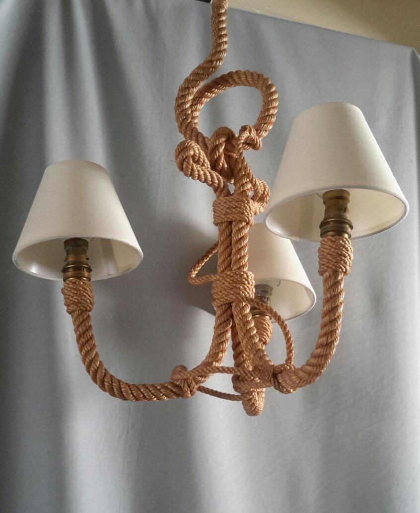 French Marine Ancor shaped 3 arms chandelier in rope, 1960s by Audoux Minet.
The chandelier has new ivory white cotton lampshades.
Electrical part is in accordance with the US standard. (baïonnet socket 40 watts maxi per