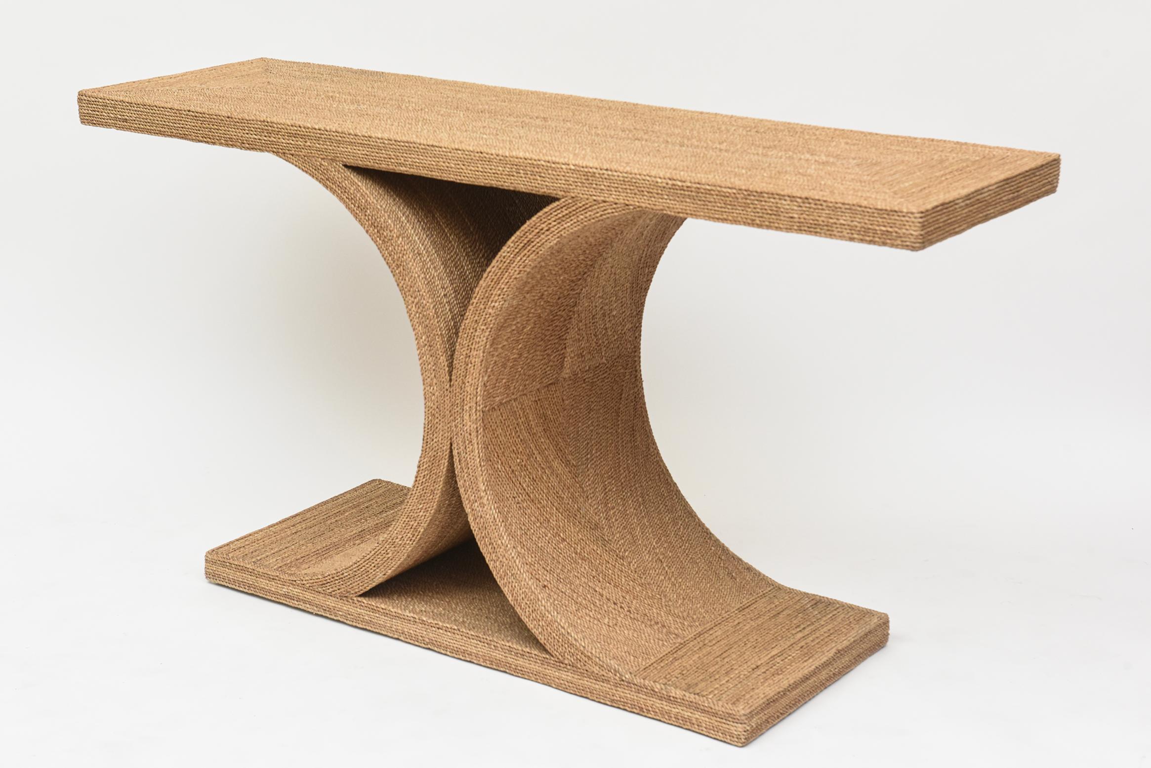 A casual riff on the JMF console by Karl Springer (which was inspired by a much earlier Jean Michel Frank design), this rope stylish console threads the needle between formal and fresh, bourgeois and beachy.