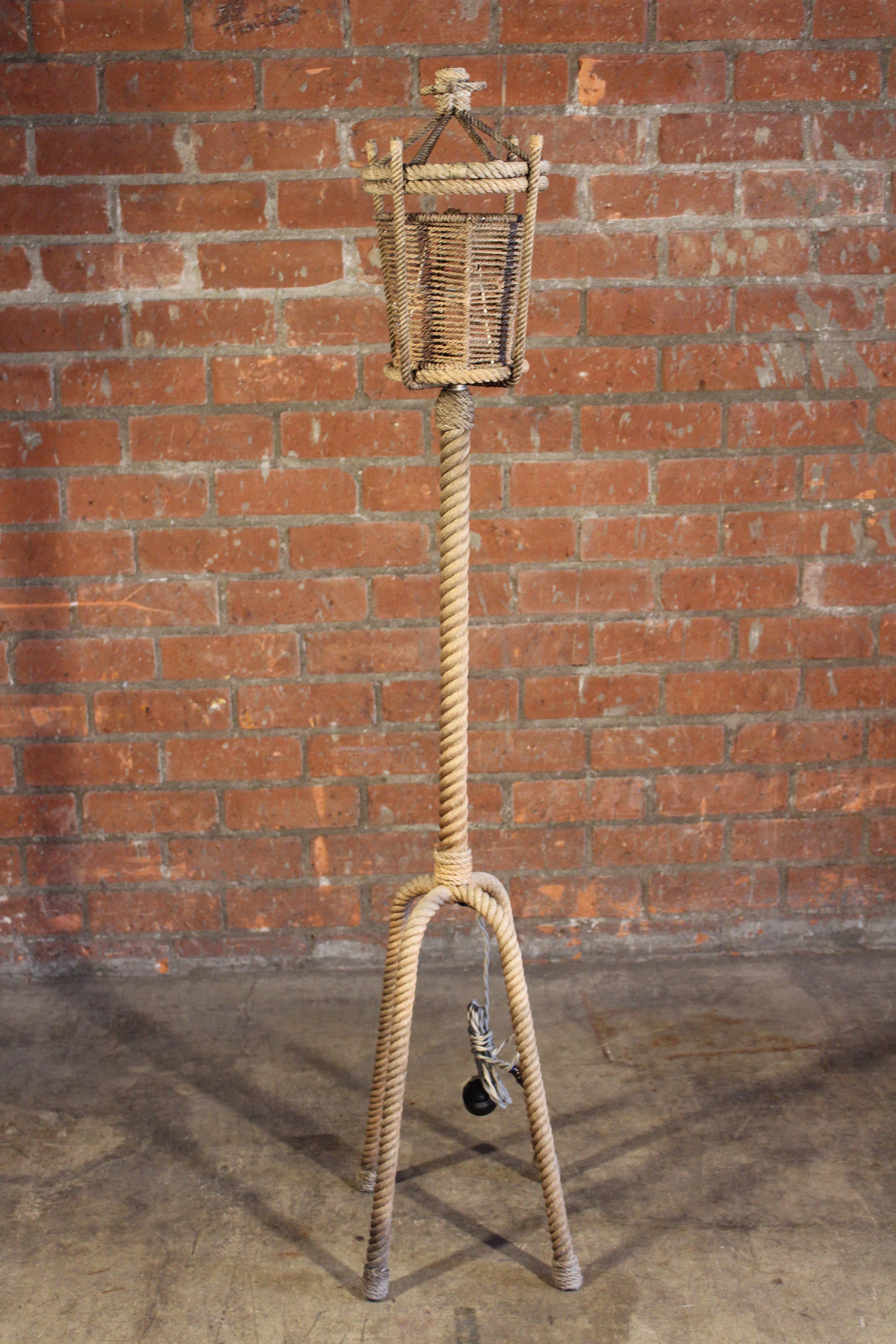 A vintage rope floor lamp by Audoux-Minet. Newly rewired for U.S standards. Shows age-appropriate wear and some fading.