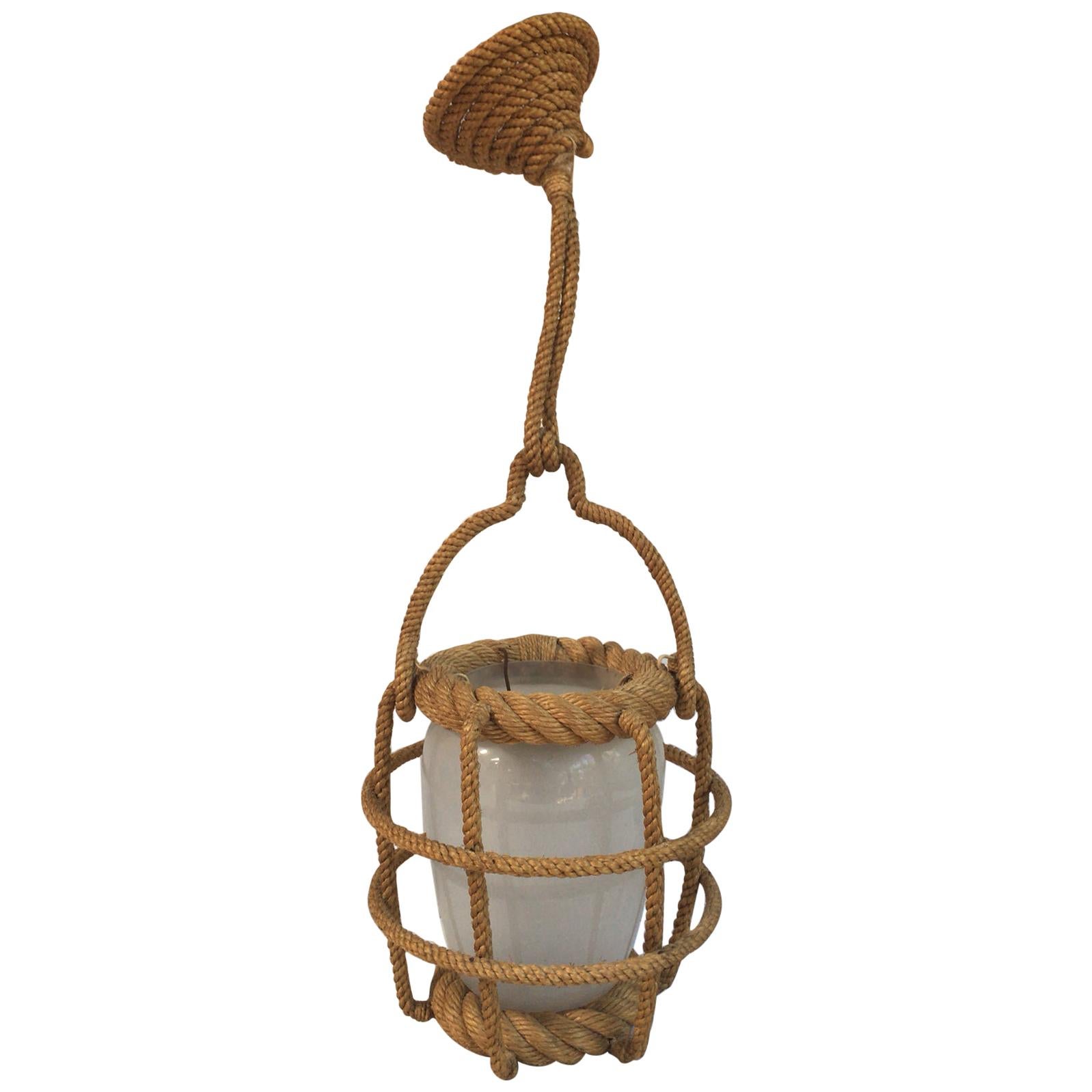 Rope circular lantern chandelier Audoux Minet, circa 1960 with white opaline glass.
Measures: Height / 20 inches with the rope, diameter / 7.5 on 8 inches.
Nautical style.