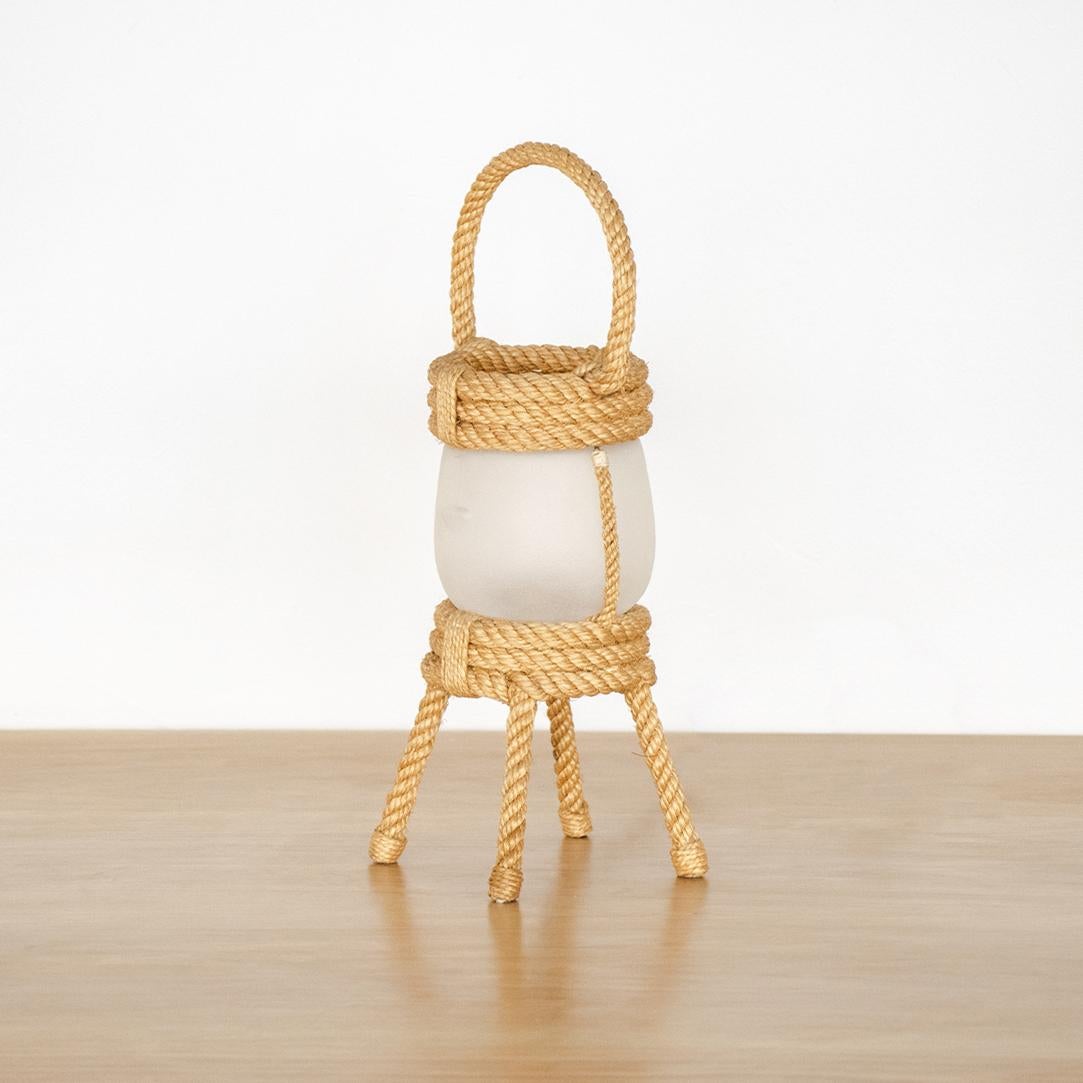 Petite rope lantern table lamp by Adrien Audoux & Frida Minet, France, 1950s. Coiled rope frame with 4 rope feet and top rope handle. Original frosted glass interior shade and newly re-wired. Excellent condition. Takes one E12 base bulb, up to 25