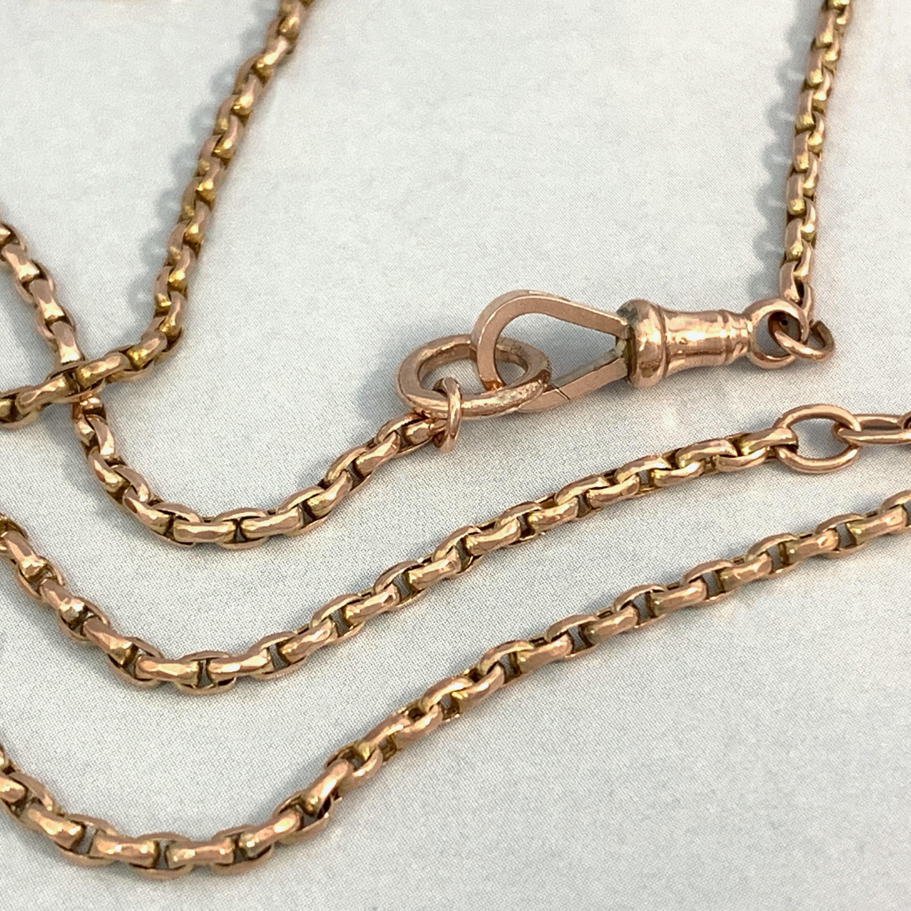 This sleek, versatile chain probably dates from before 1900 and would have been used for a lady's lorgnette, muff or watch.

It features tightly spaced oval belcher links in a with an adjuster ring 9