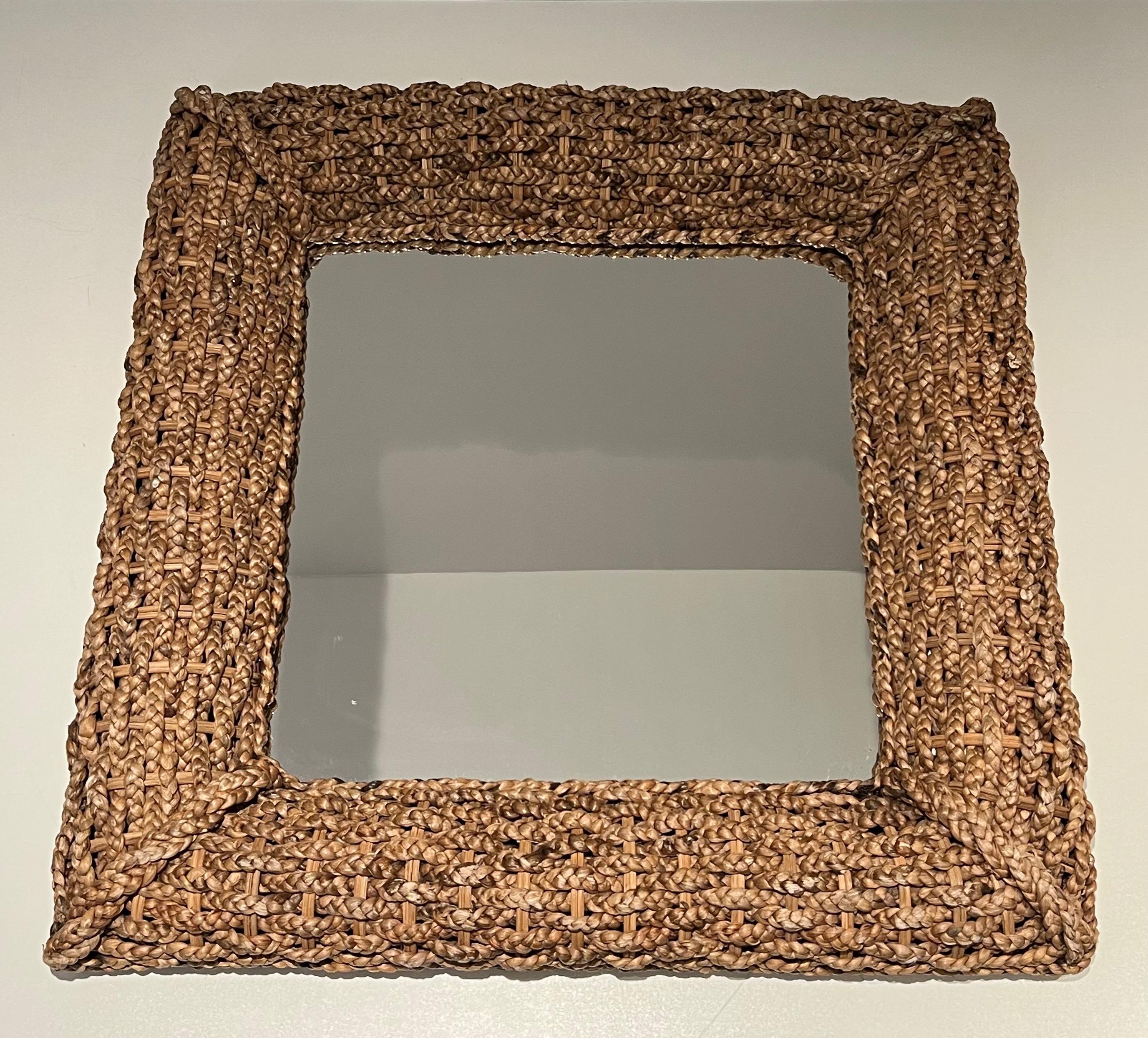 This very nice and decorative thick mirror is made of a nice rope work. This is a French work attributed to famous designers Adrien Audoux and Frida Minet. Circa 1950