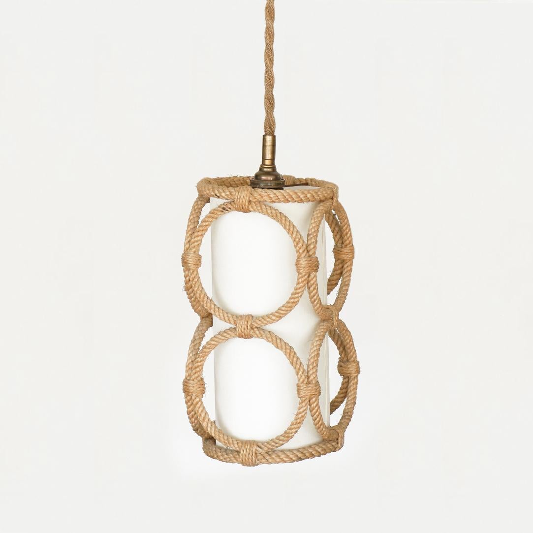 Beautiful rope pendant light by Adrien Audoux & Frida Minet, France, 1950s. Long cylindrical rope frame with circle rope design on sides. New interior silk shade and newly re-wired with thick cloth cord to hang. Overall height can be specified by