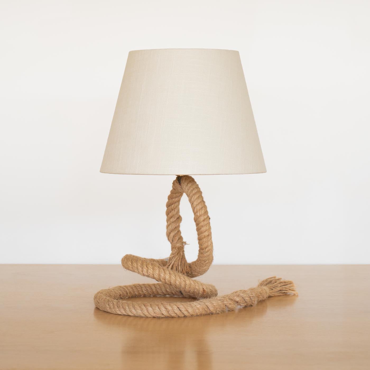 Rope table lamp by Adrien Audoux & Frida Minet, France, 1950s. Beautiful sculptural rope form with circular base, and tassel tail detail. New linen shade and newly re-wired. Takes one E12 base bulb, 60 W or higher using LED.

