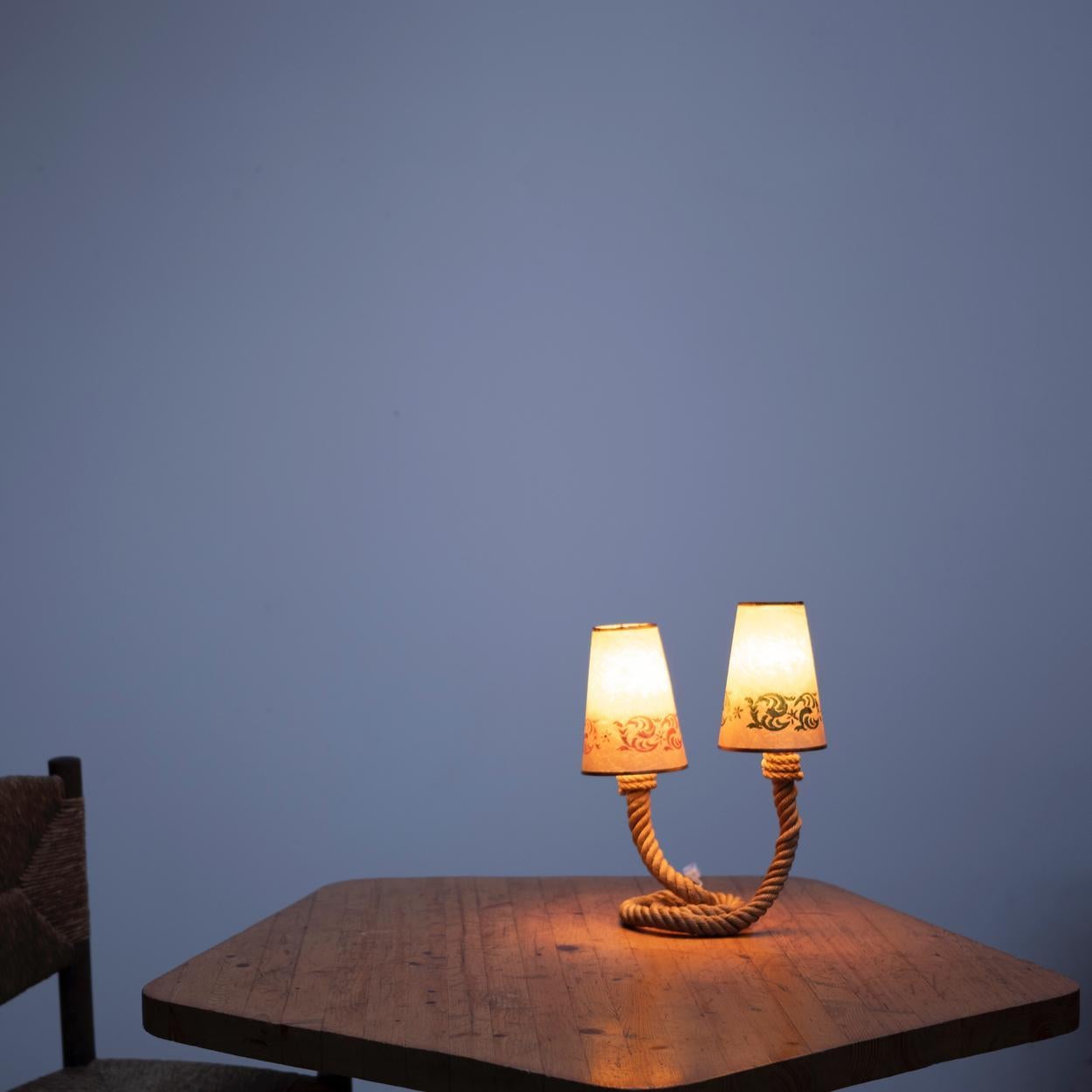 Rope table lamp with paper shade in 1960s.
Beautiful and elegant piece that reminds us the design of Audoux - Minet.
Rewired.
