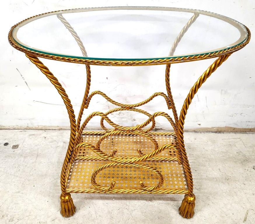 For FULL item description click on CONTINUE READING at the bottom of this page.

Offering One Of Our Recent Palm Beach Estate Fine Furniture Acquisitions Of A
Mid-Century Rope & Tassel Italian Gilt Table 
Can be used as a side table for