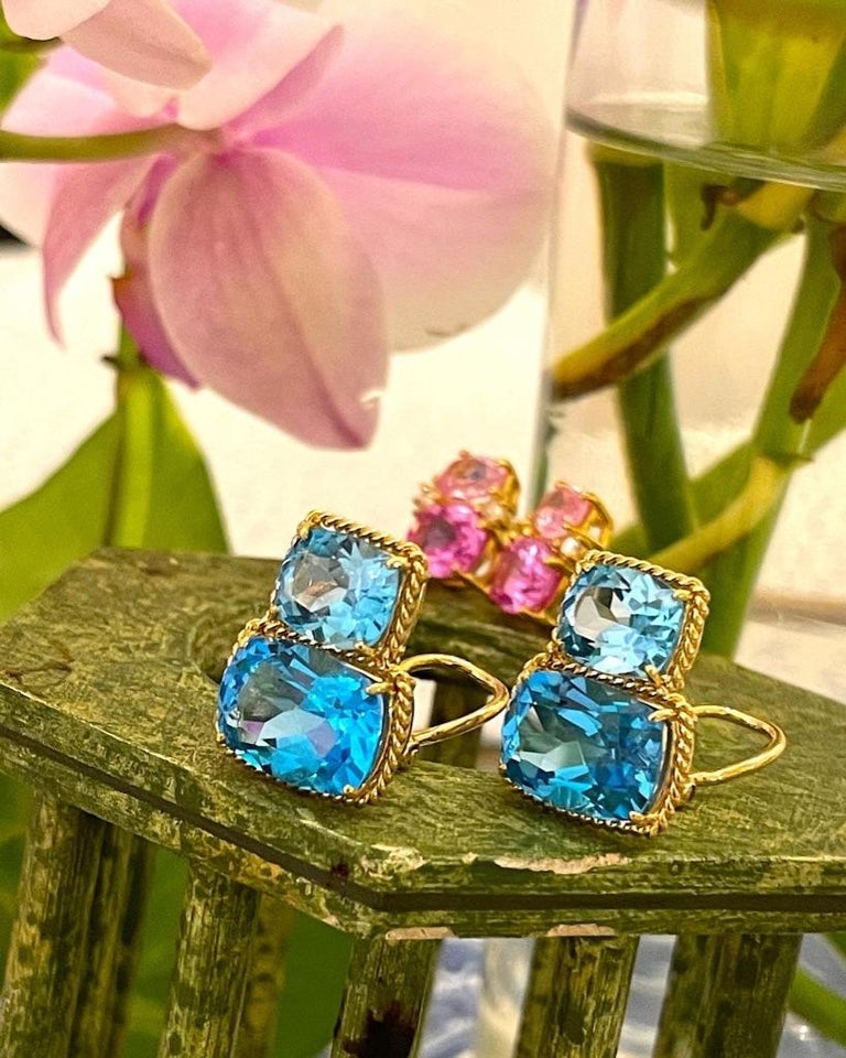 Elegant 18kt Yellow Gold Rope Twist Border two stone Earring with faceted Lemon Citrine and Pale Blue Topaz. This is a classic day to evening earring that can be made clip or pierced.

The meaning measures 3/4' tall and 1/2