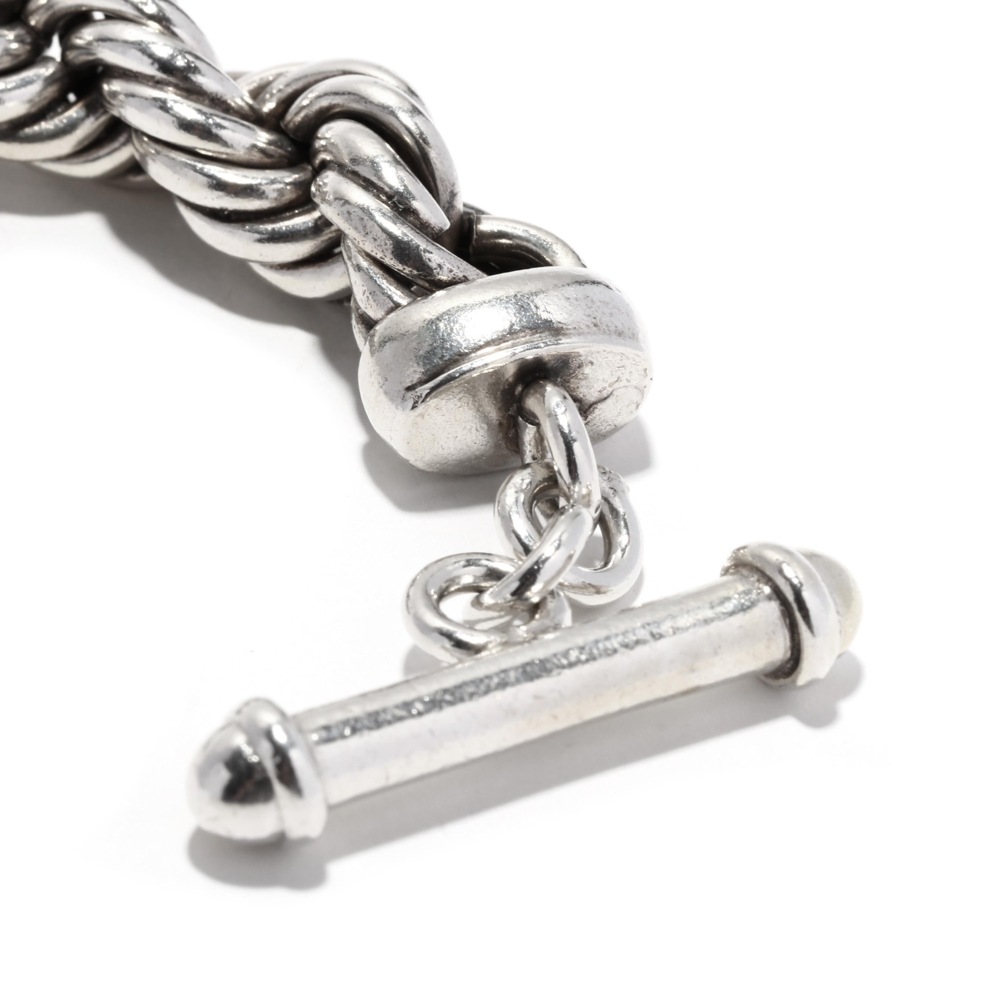 This beautiful rope twist toggle bracelet is the perfect accessory to complete any look. Crafted from sterling silver, this 8.5-inch chain bracelet features a unique rope twist toggle closure. Its simple yet elegant design will add a touch of