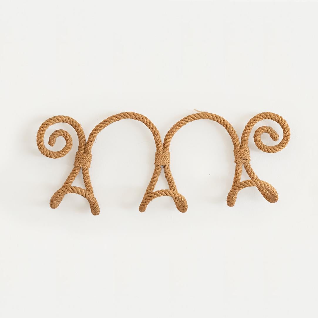 Beautiful French wall hook made of thick twisted rope and twine by Audoux-Minet. Great curved tongue shaped hooks, perfect to hold hats or coats.