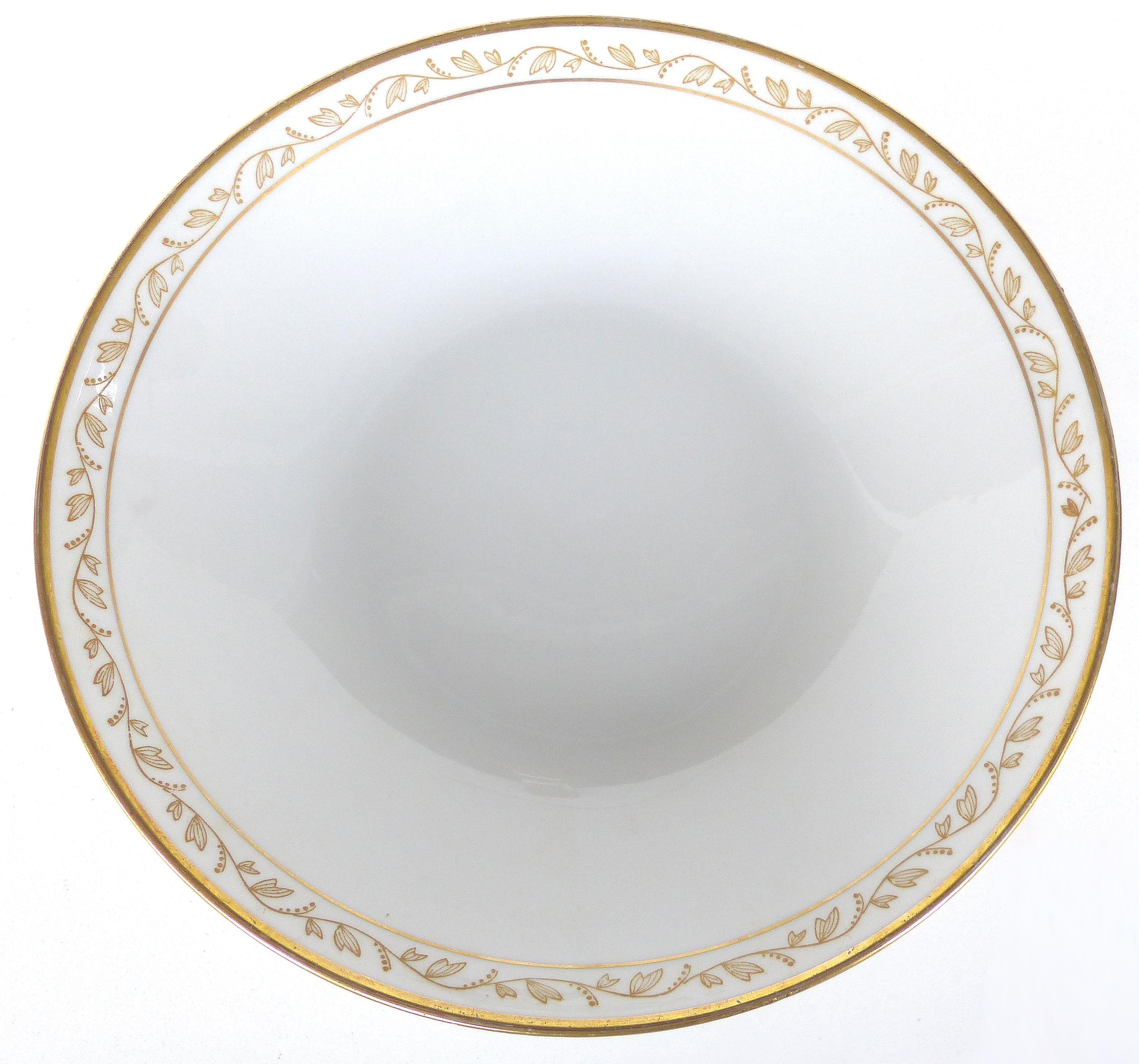 Offered for sale is a set of 12 porcelain China bowls by Rörstrand Sweden in the Delicia pattern. These china bowls have a gilt vine decoration and banding on the rims.