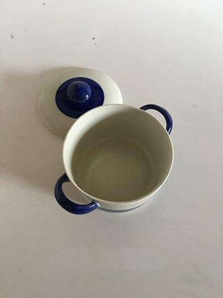 Rörstrand blue Koka bowl with lid and handles.

Measures: 9.5 cm height 3 47/64
