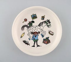 Rörstrand, Four Cups and a Plate in Porcelain with Pippi Longstocking Motifs