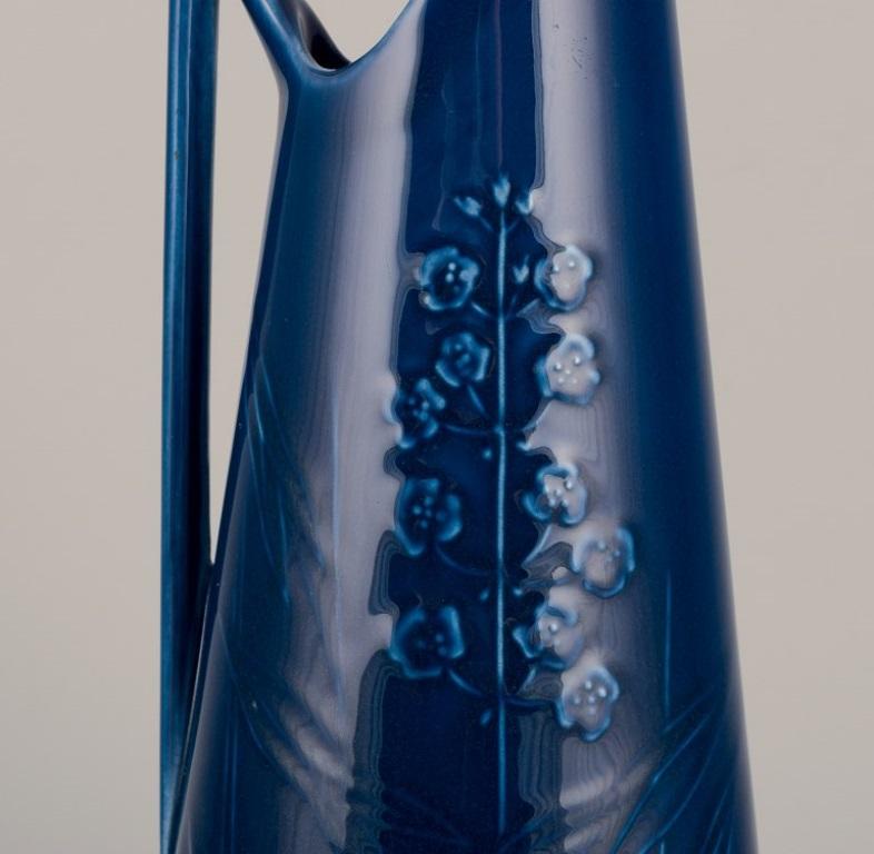 Rörstrand, large pitcher in porcelain.
Floral motifs. Blue glaze.
Handmade.
In perfect condition.
Marked.
First factory quality.
Dimensions: Height 29.0 cm x Diameter 9.0 cm.
