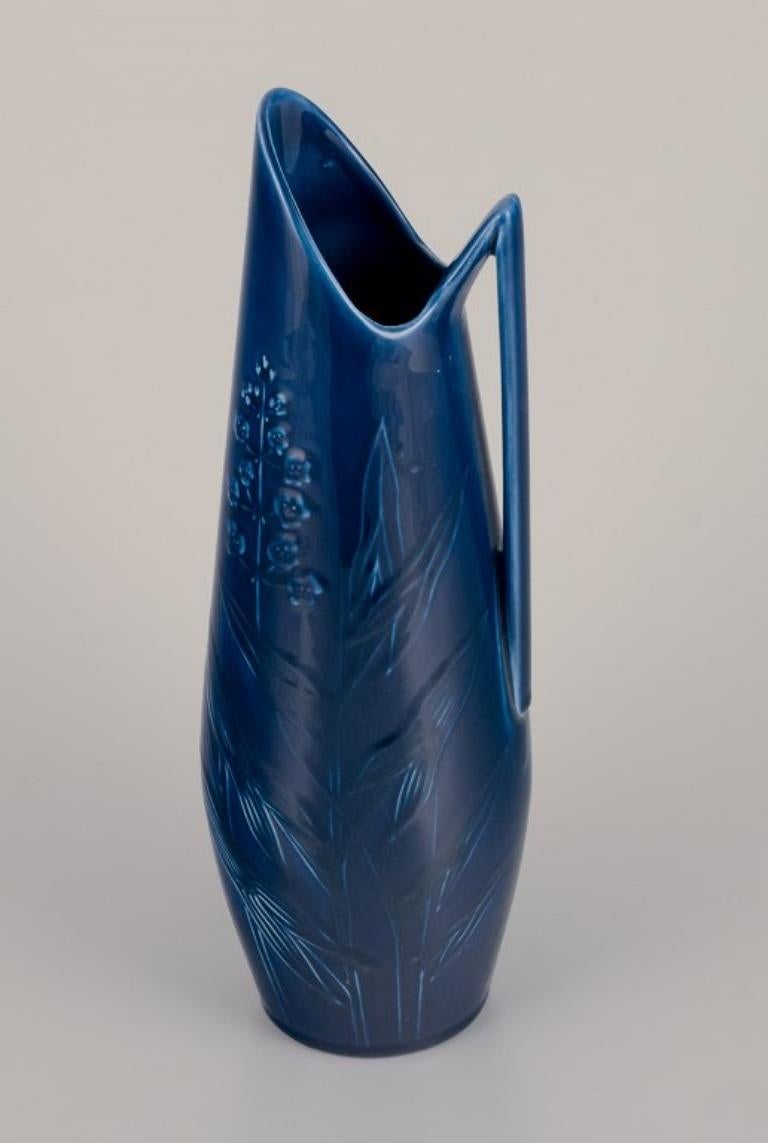 Swedish Rörstrand, large vase / pitcher in porcelain. Floral motifs. Blue glaze. For Sale