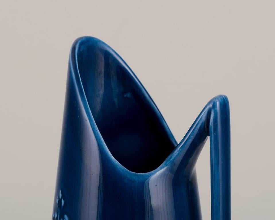 Glazed Rörstrand, large vase / pitcher in porcelain. Floral motifs. Blue glaze. For Sale