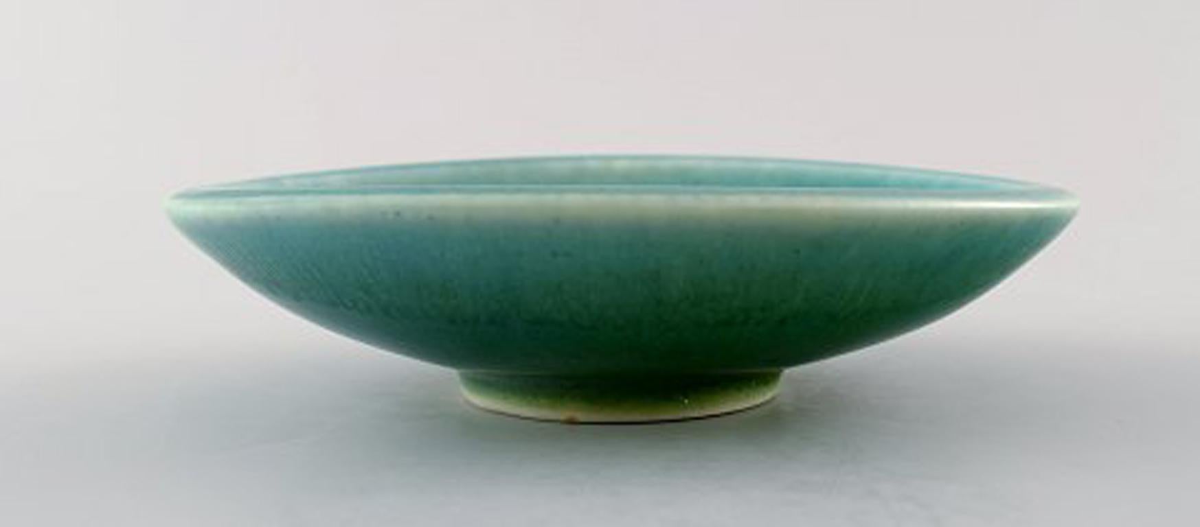 Rörstrand/Rorstrand Gunnar Nylund ceramic bowl.
Beautiful green speckled glaze.
Measures: 14 cm. x 3.5 cm.
Stamped.
In perfect condition.
1st. Factory quality