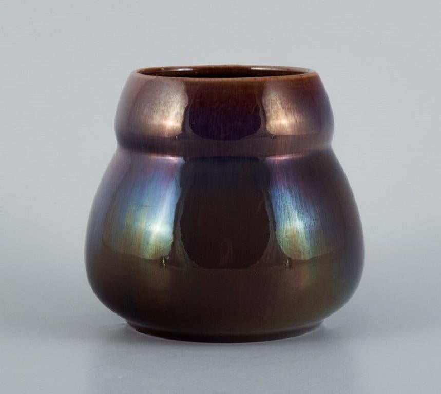 Rörstrand, Sweden, earthenware vase in brown / purple luster glaze.
Early 20th century.
In perfect condition.
First factory quality.
Marked.
Measuring: D 13.0 x H 13.0 cm.