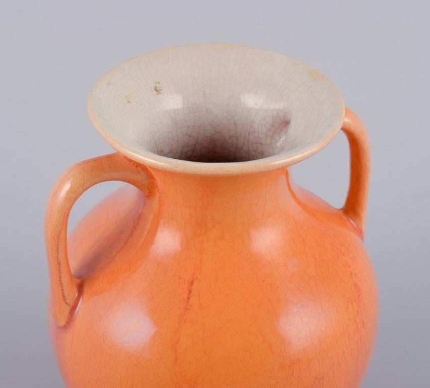 Glazed Rörstrand, Sweden, earthenware vase with handles in uranium yellow glaze. For Sale