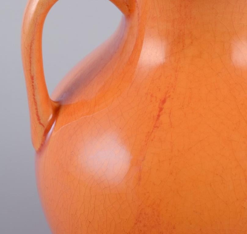 Rörstrand, Sweden, earthenware vase with handles in uranium yellow glaze. In Excellent Condition For Sale In Copenhagen, DK