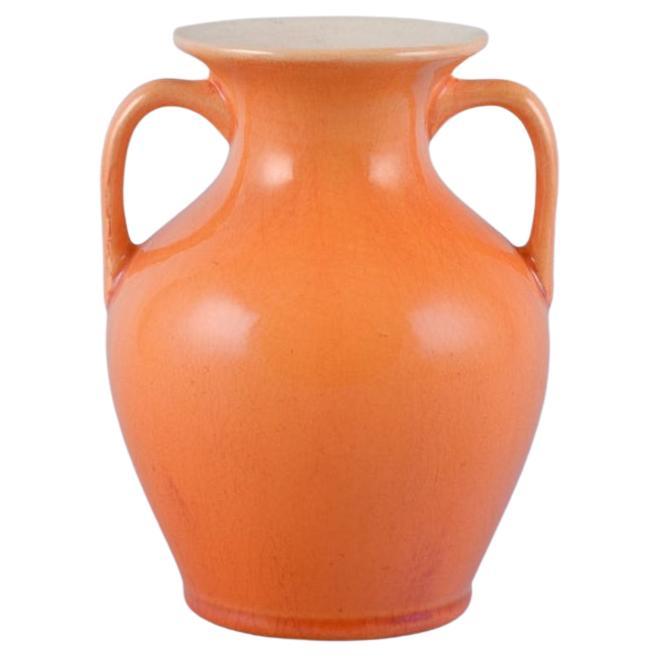 Rörstrand, Sweden, earthenware vase with handles in uranium yellow glaze. For Sale