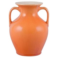 Antique Rörstrand, Sweden, earthenware vase with handles in uranium yellow glaze.
