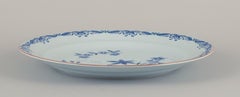 Rörstrand, Sweden, large round "Ostindia" platter in faience with flower motifs.