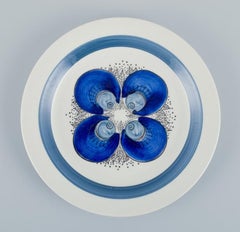 Rörstrand, Sweden, set of five hand-painted "Iris" plates. From the 1970s.