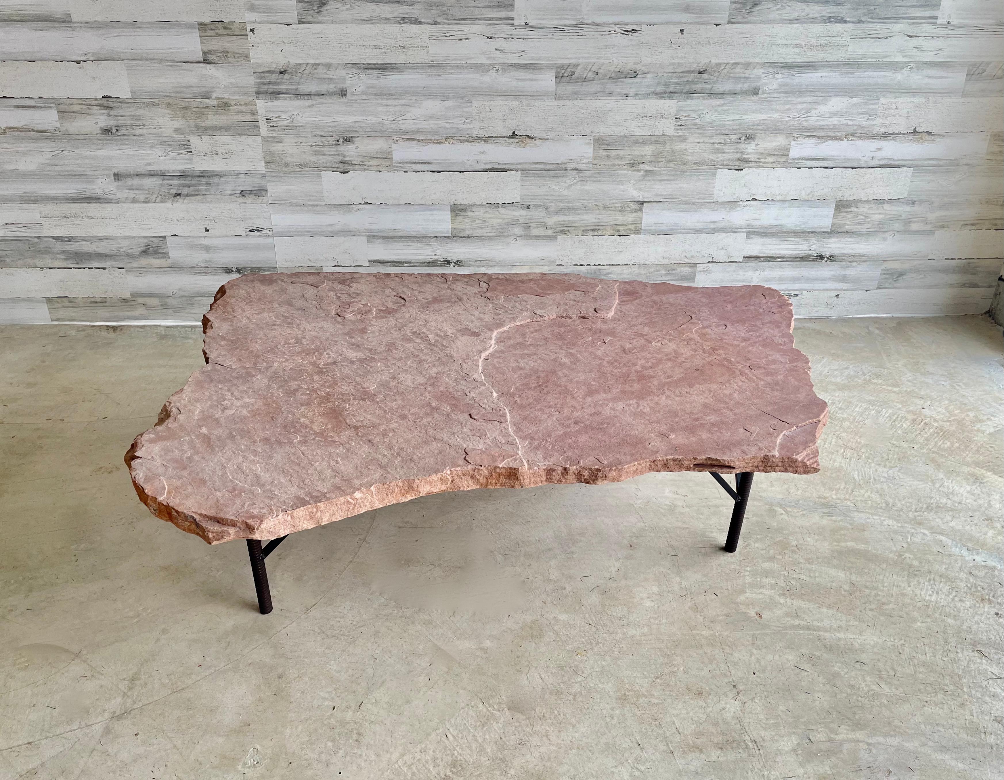 Rosa flagstone and iron coffee table. Unique welded iron base with a huge rosa flagstone slab on top.
