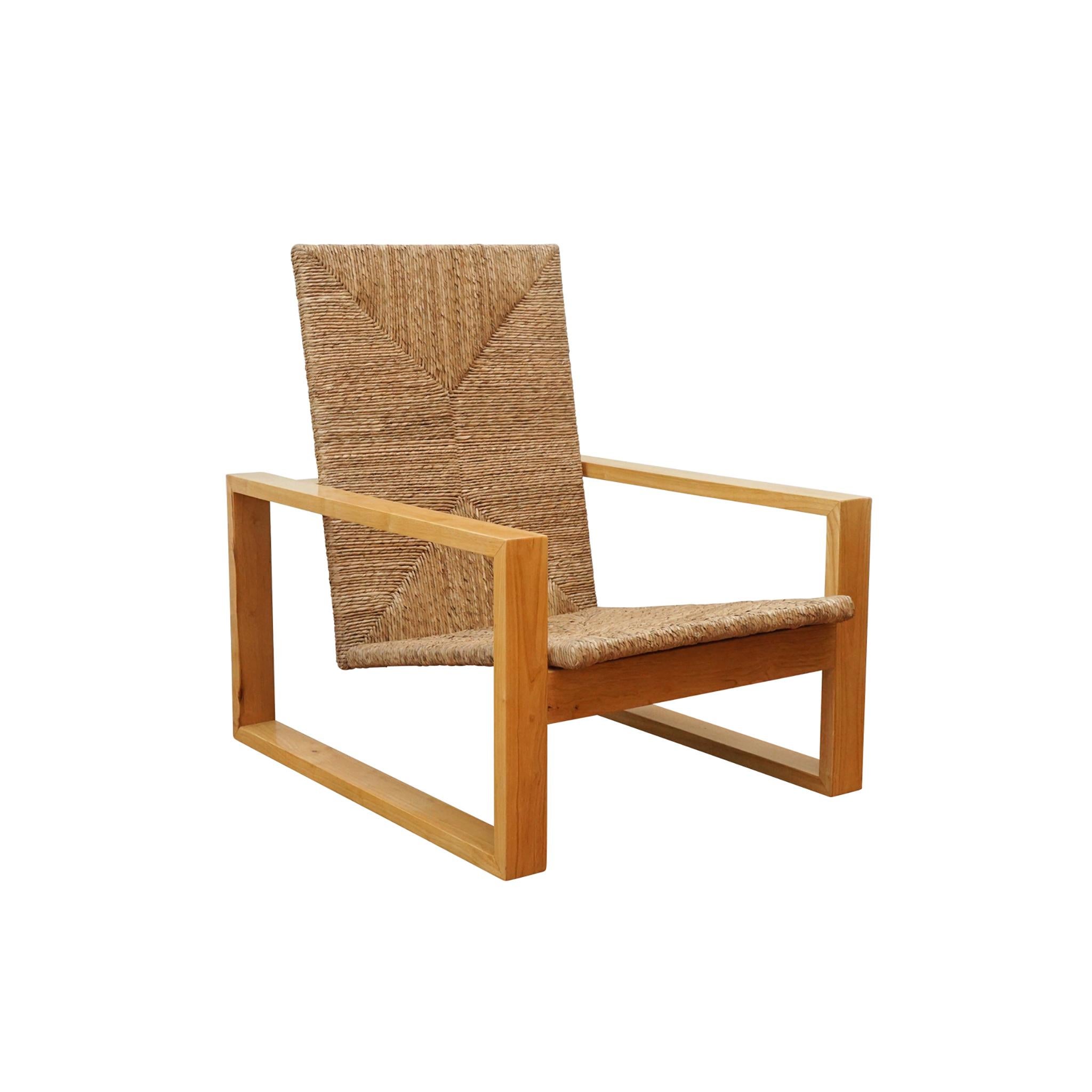 Modern open square armchair inspired by the Bauhaus Movement. Finishes available in blonde primavera wood with braided abaca or ebonized rosa morada wood with ebonized rattan. Cushions available in COM. 

COM: 2 yards

Measurements:
width:
