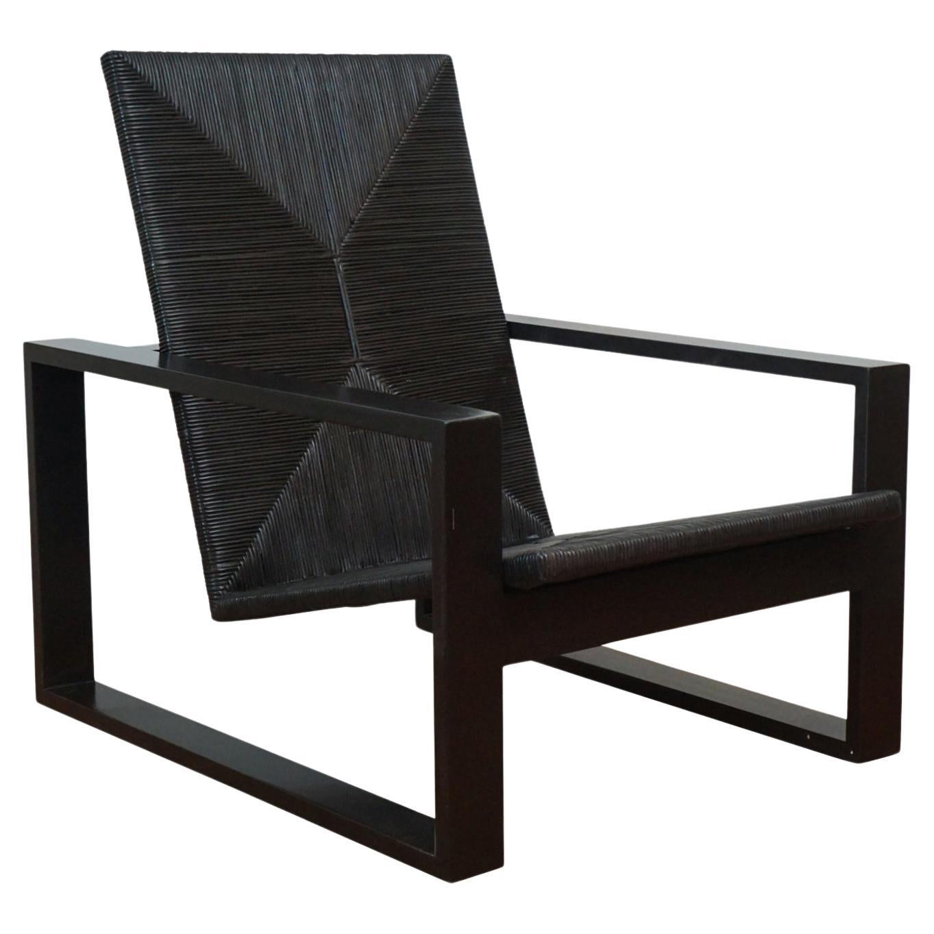 Rosa Morada Wood and ebonized rattan chair "Palmilla"  For Sale