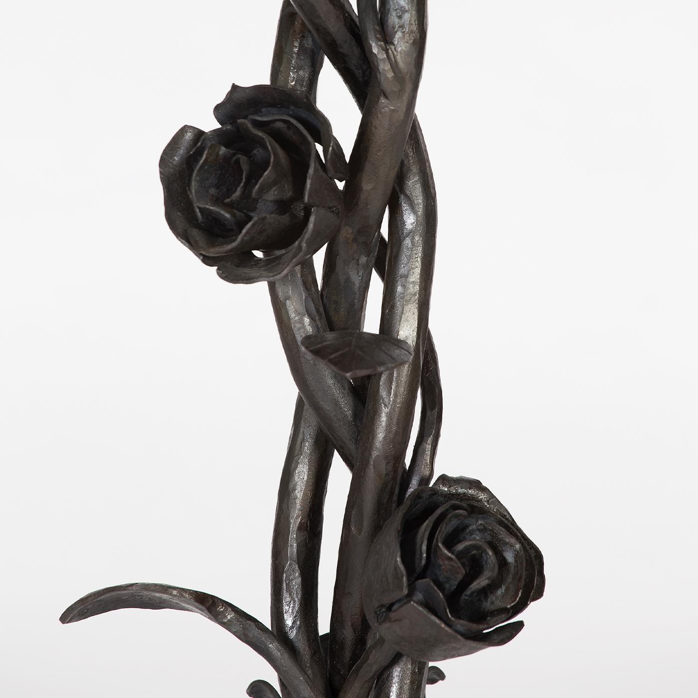 Utmost elegance defines this extraordinary ornamental side table handmade of beaten iron, finished with clear acrylic paint and decorated with rosebuds blooming from the three intertwined branches. Timelessly sophisticated, it is suitable for any