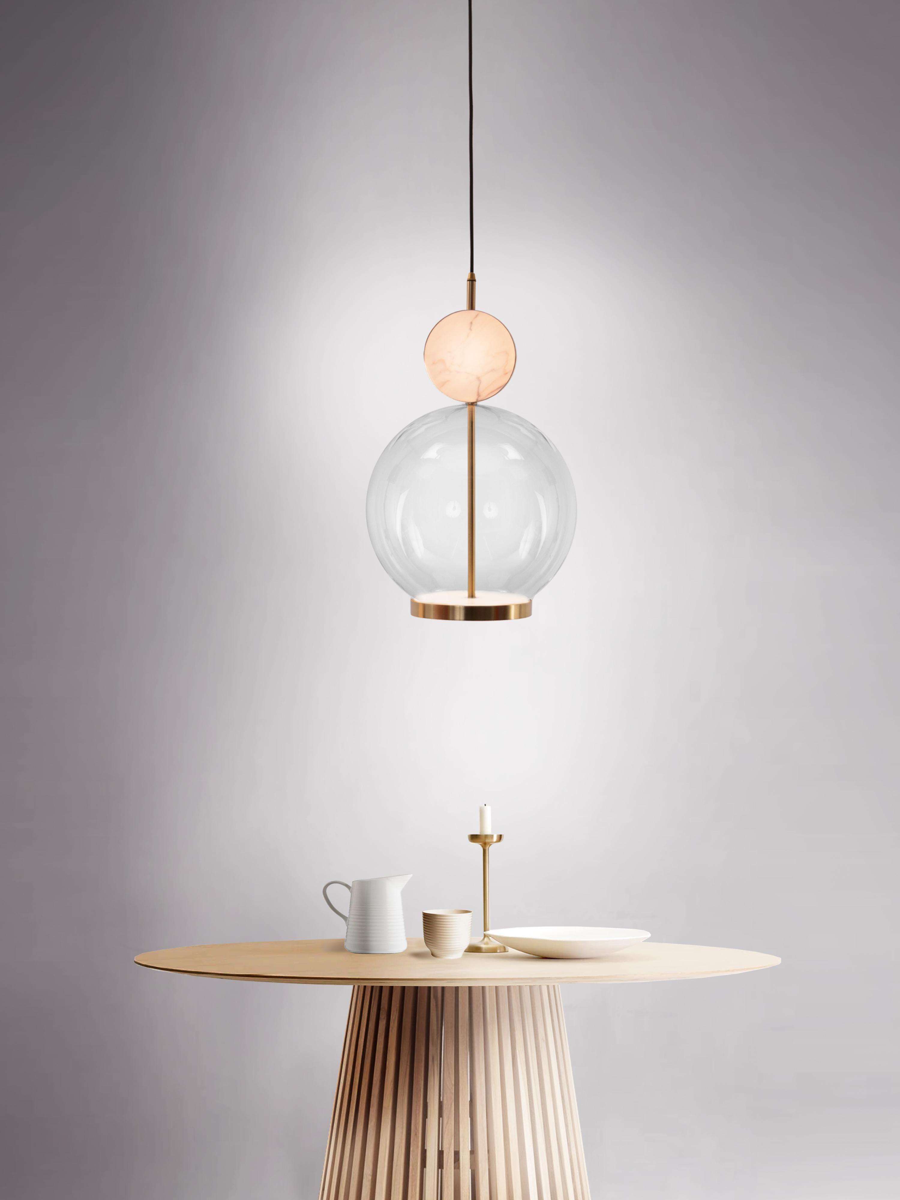 The Rosa collection was designed to showcase the opaque beauty of natural marble. The pendant incorporates a backlit Rosa Estremoz marble disc that emits a soft, warm illumination, pierced by the natural veining of the stone.

The double faced LED