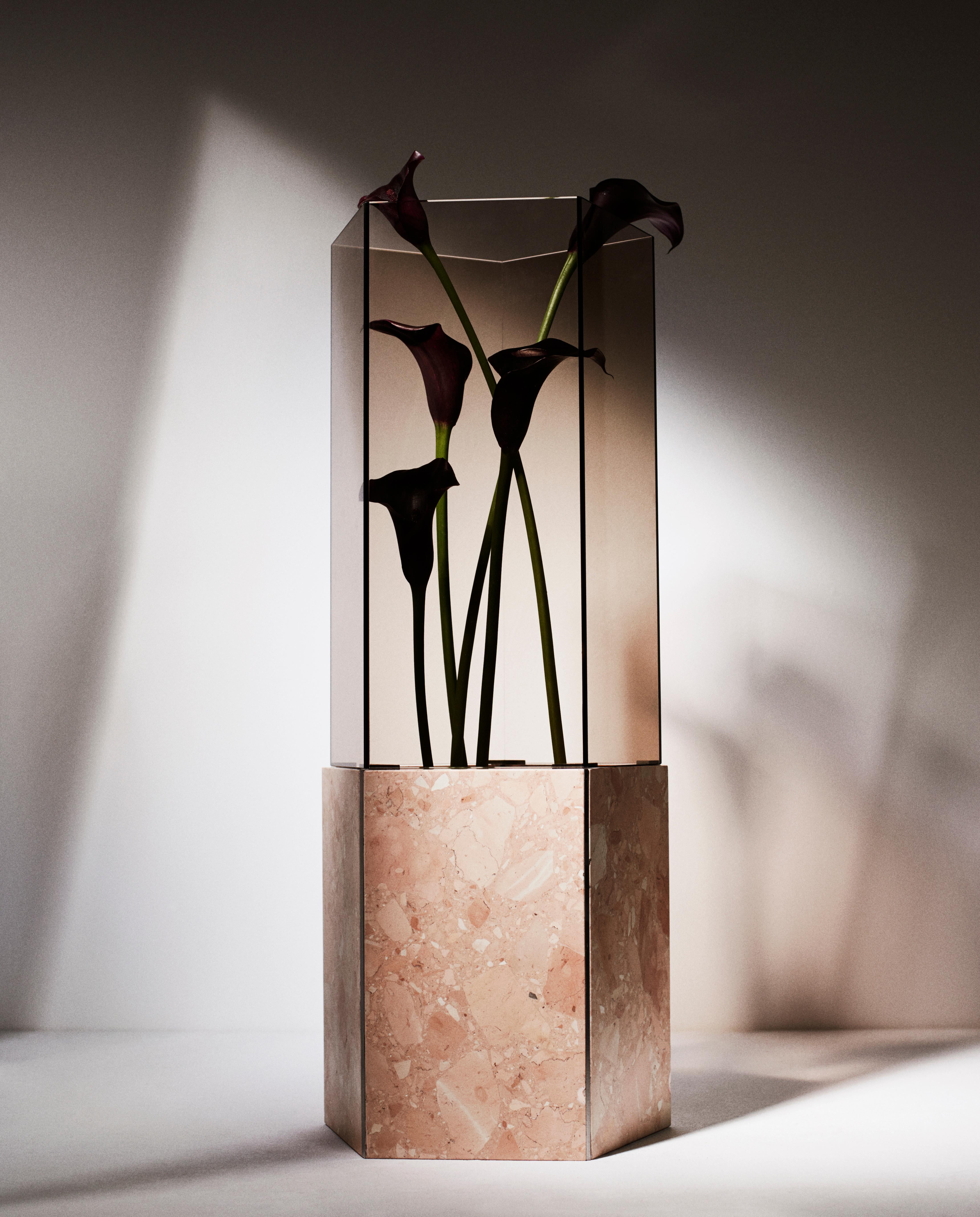 Rosa Perlino Pentagonal Narcissus 2017 Vase by Tino Seubert
Dimensions: Ø24 x H 60 cm.
Materials: Rosa Perlino, polished stainless steel, brown Parsol glass.
Also available in Rosso Levanto terrazzo marble. Please contact us. 

Tino