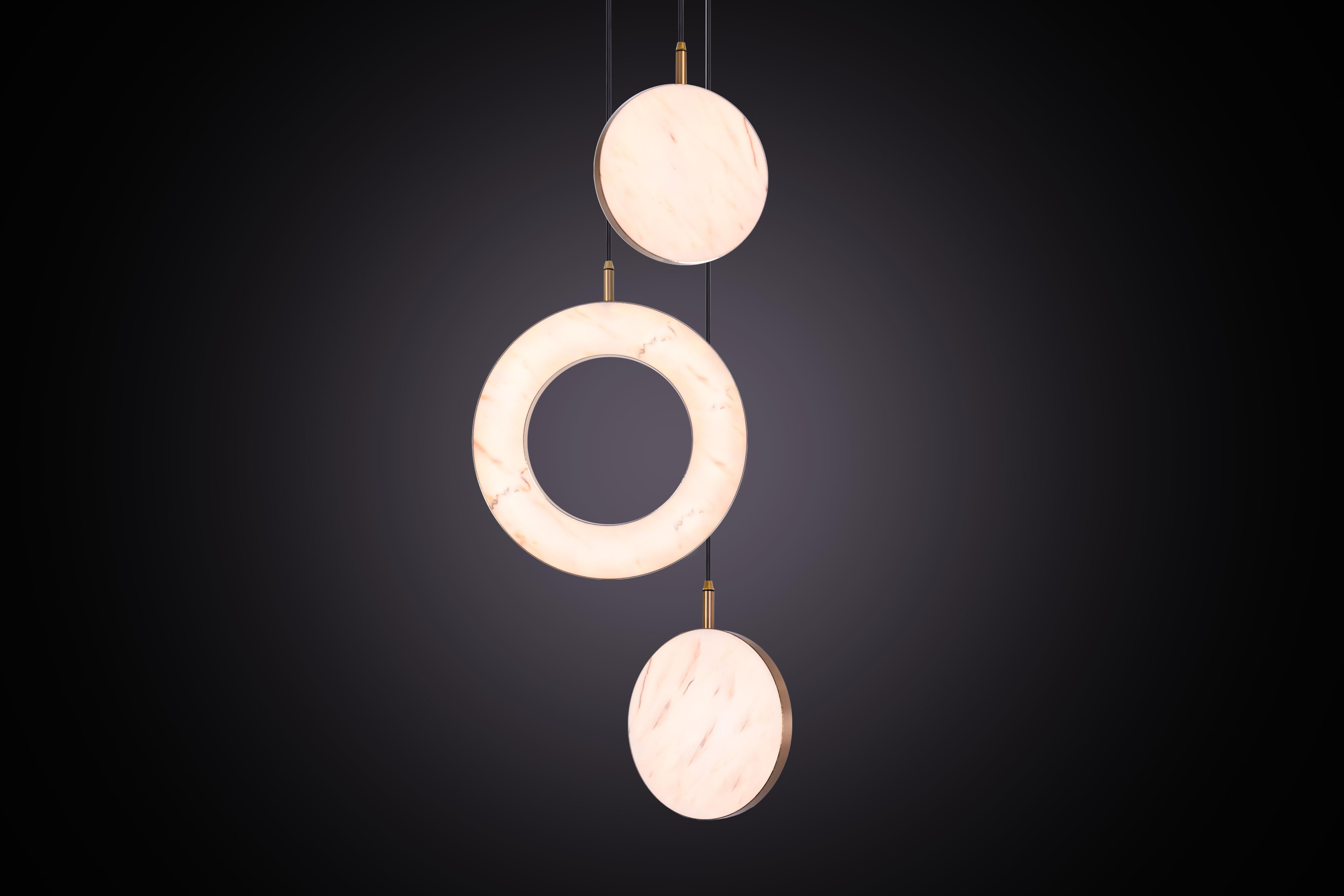 The Rosa Rings collection was designed to showcase the opaque beauty of natural marble. The pendant incorporates a backlit Rosa Estremoz marble disc that emits a soft, warm illumination, pierced by the natural veining of the stone.

Integrated
